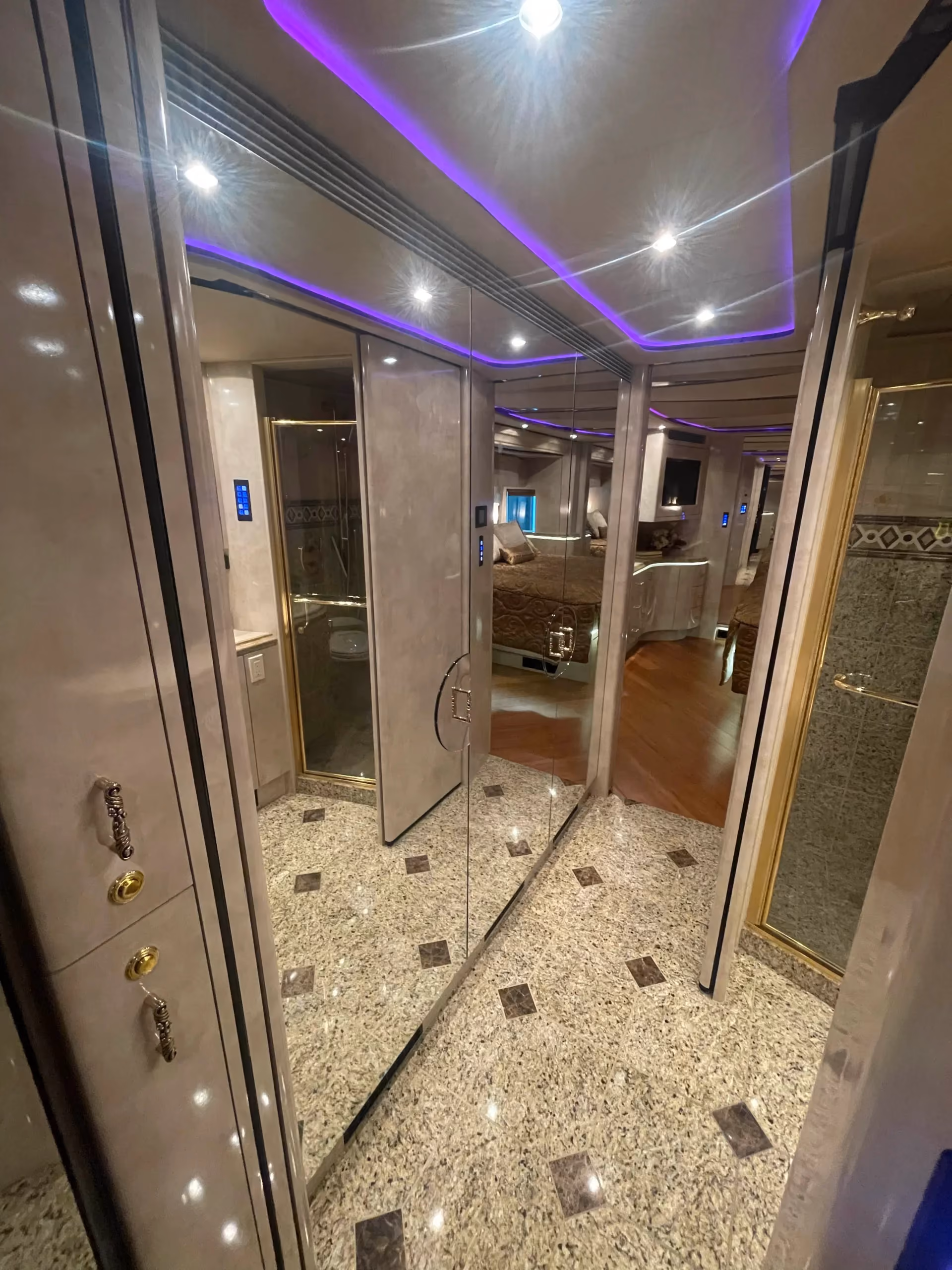 Interior galley with granite keys and cabinetry in Marathon Coach 1202