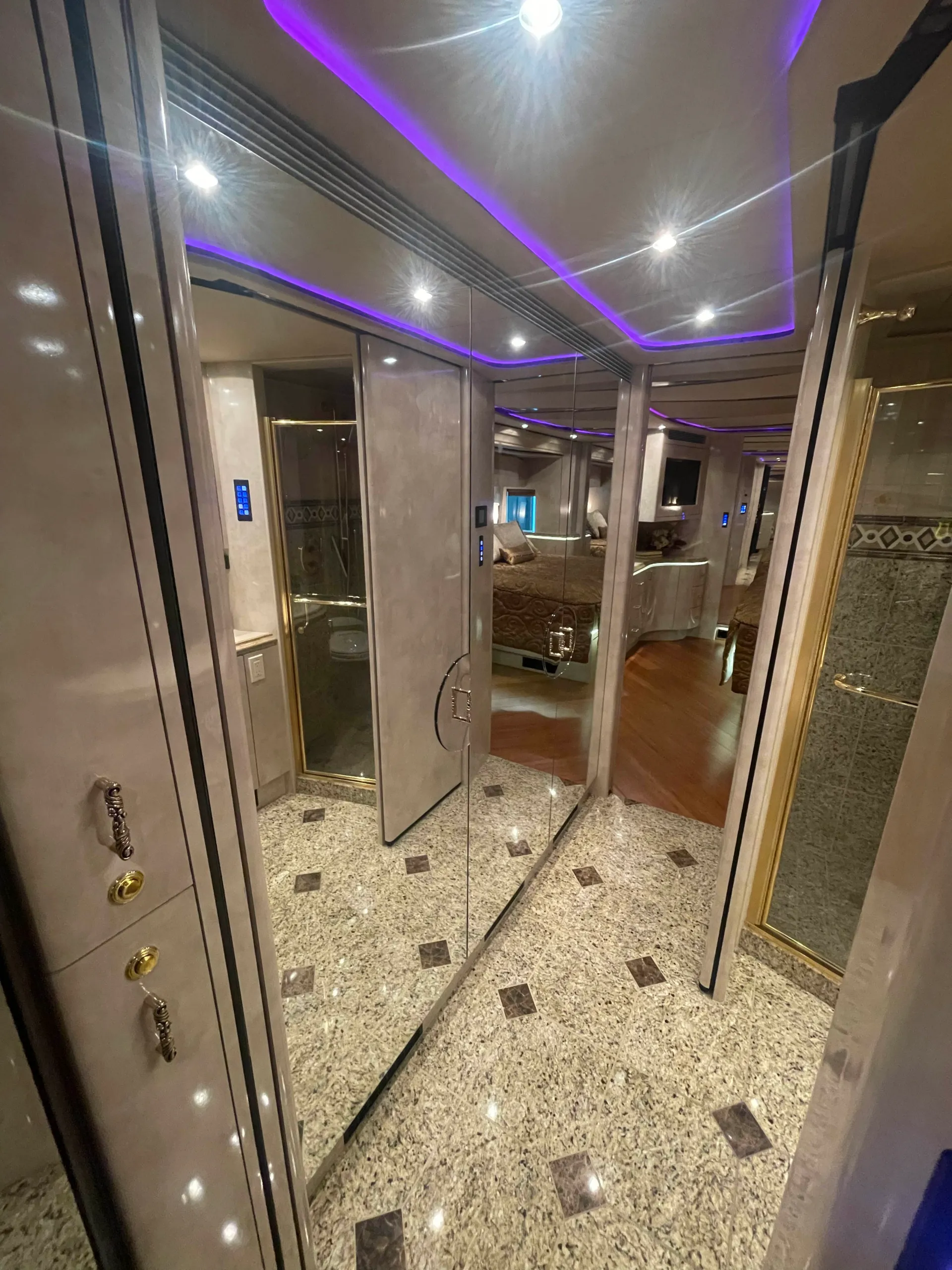 Interior galley with granite keys and cabinetry in Marathon Coach 1202