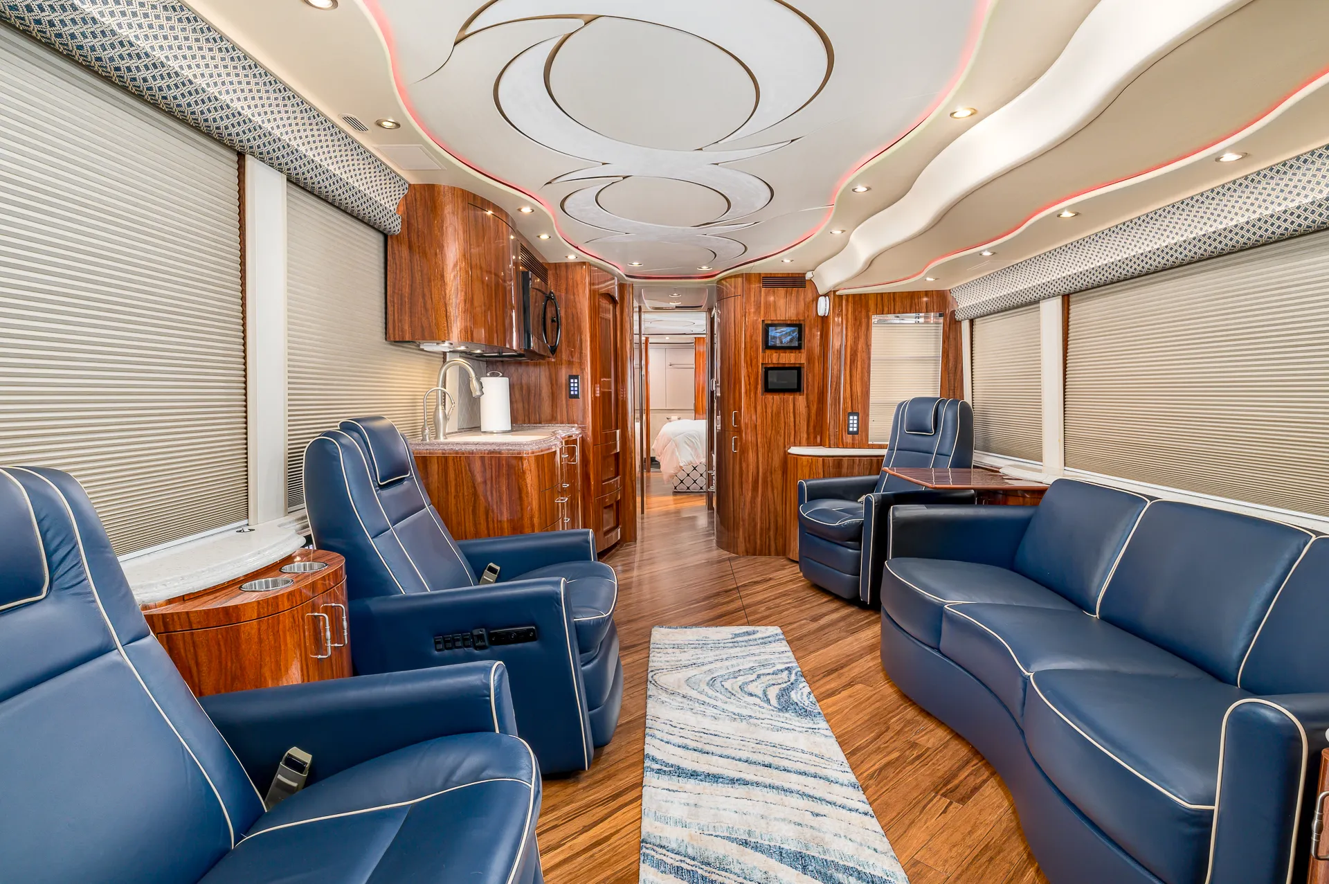 Interior salon of 2012 Marathon Coach 1205 with salon flat floor slide-out