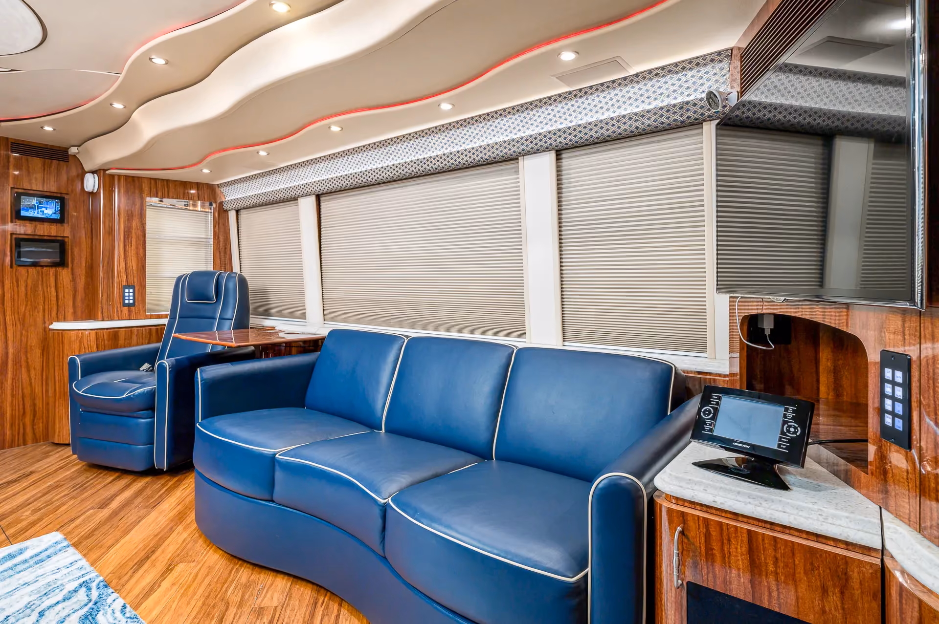 Interior living area with Crestron A/V controls in Marathon Coach 1205