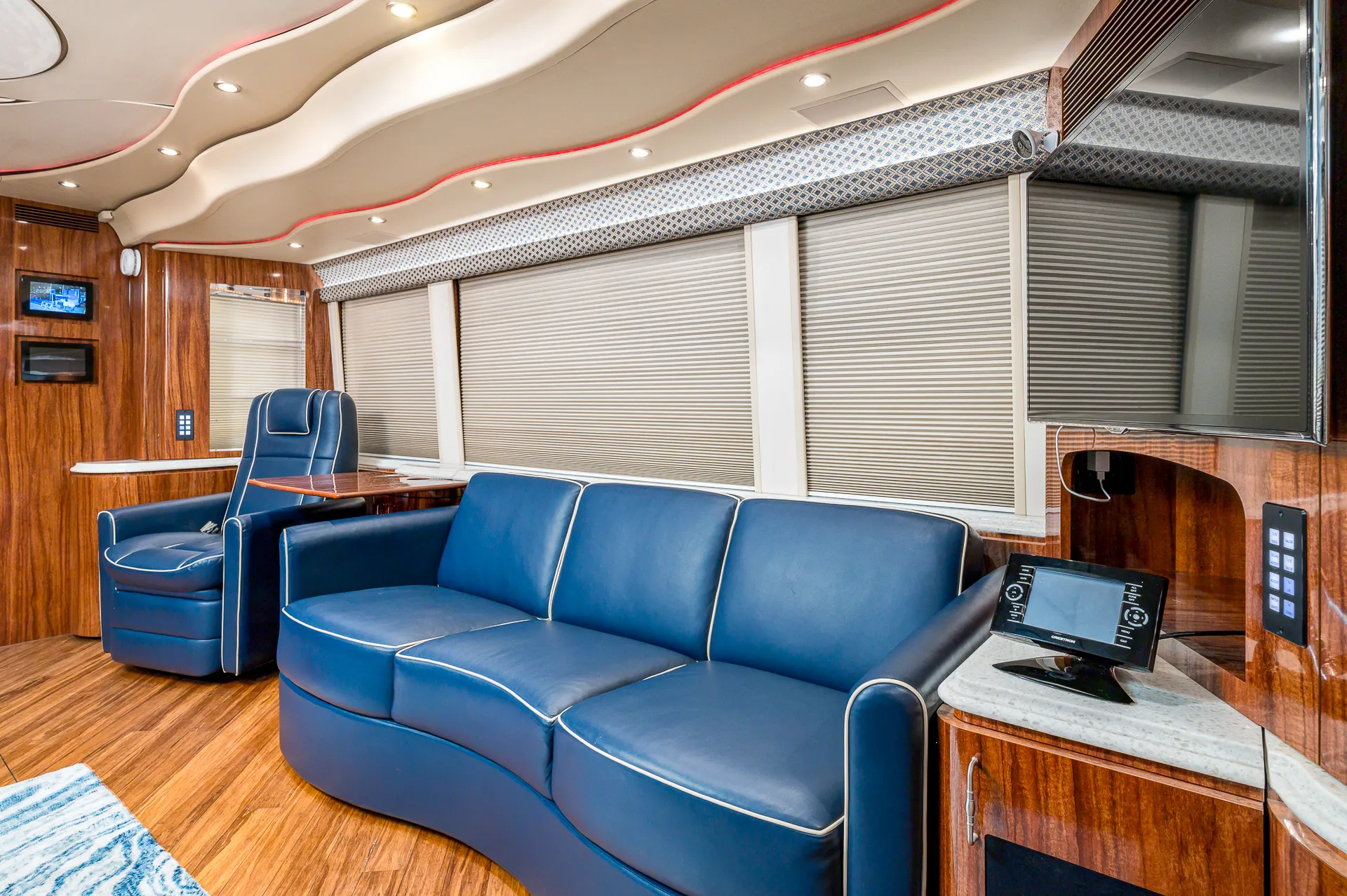 Interior living area with Crestron A/V controls in Marathon Coach 1205