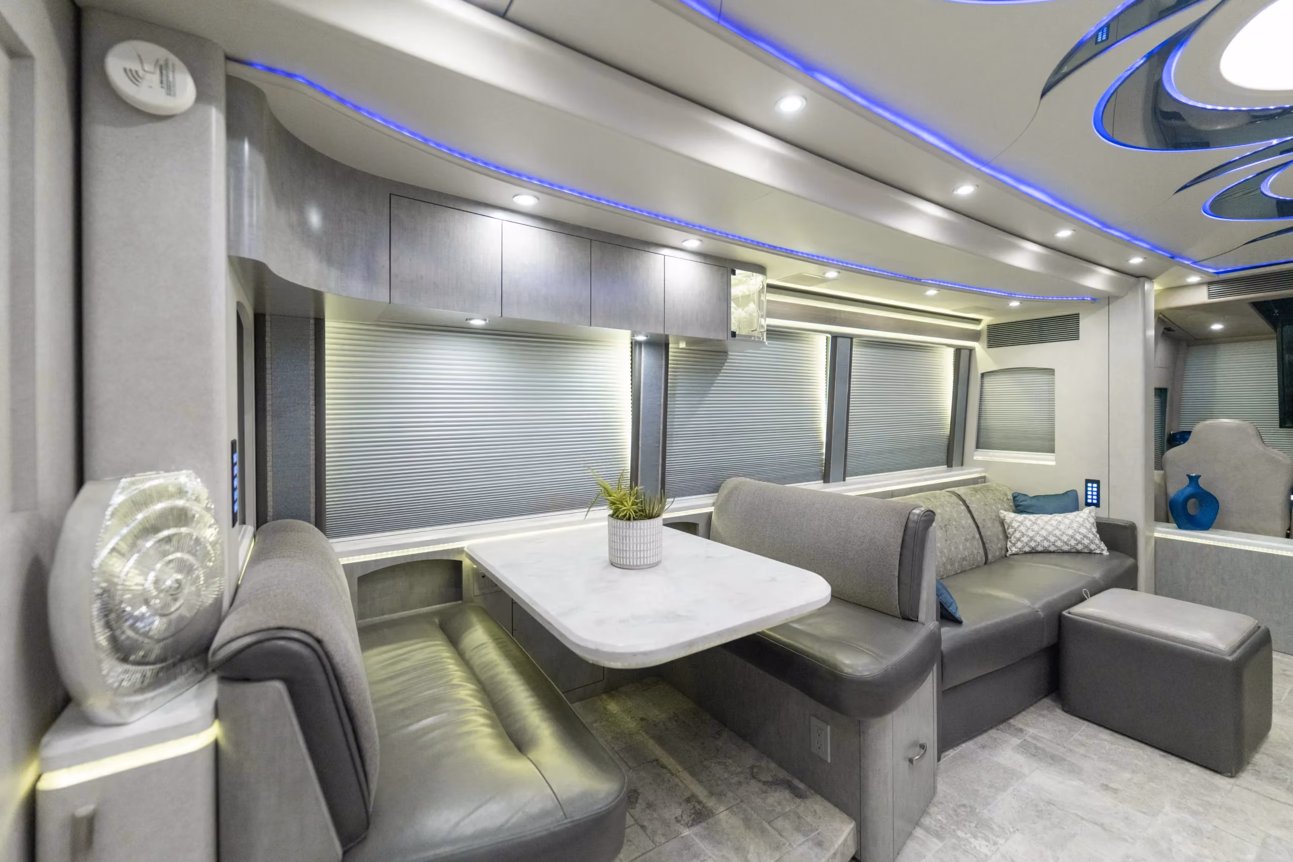 Interior bedroom of Marathon Coach 1216 with stacked washer and dryer in rear wardrobe