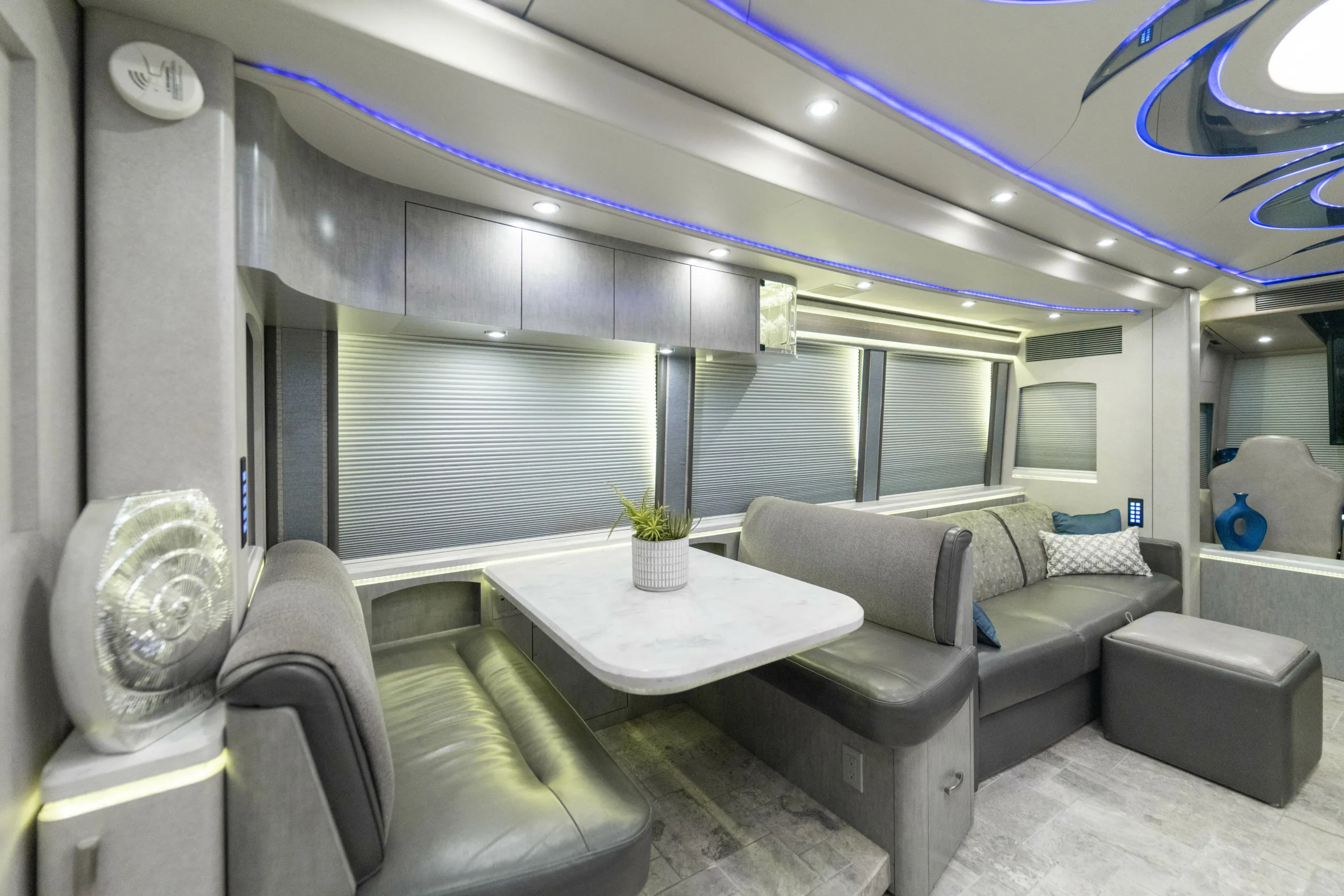 Interior bedroom of Marathon Coach 1216 with stacked washer and dryer in rear wardrobe