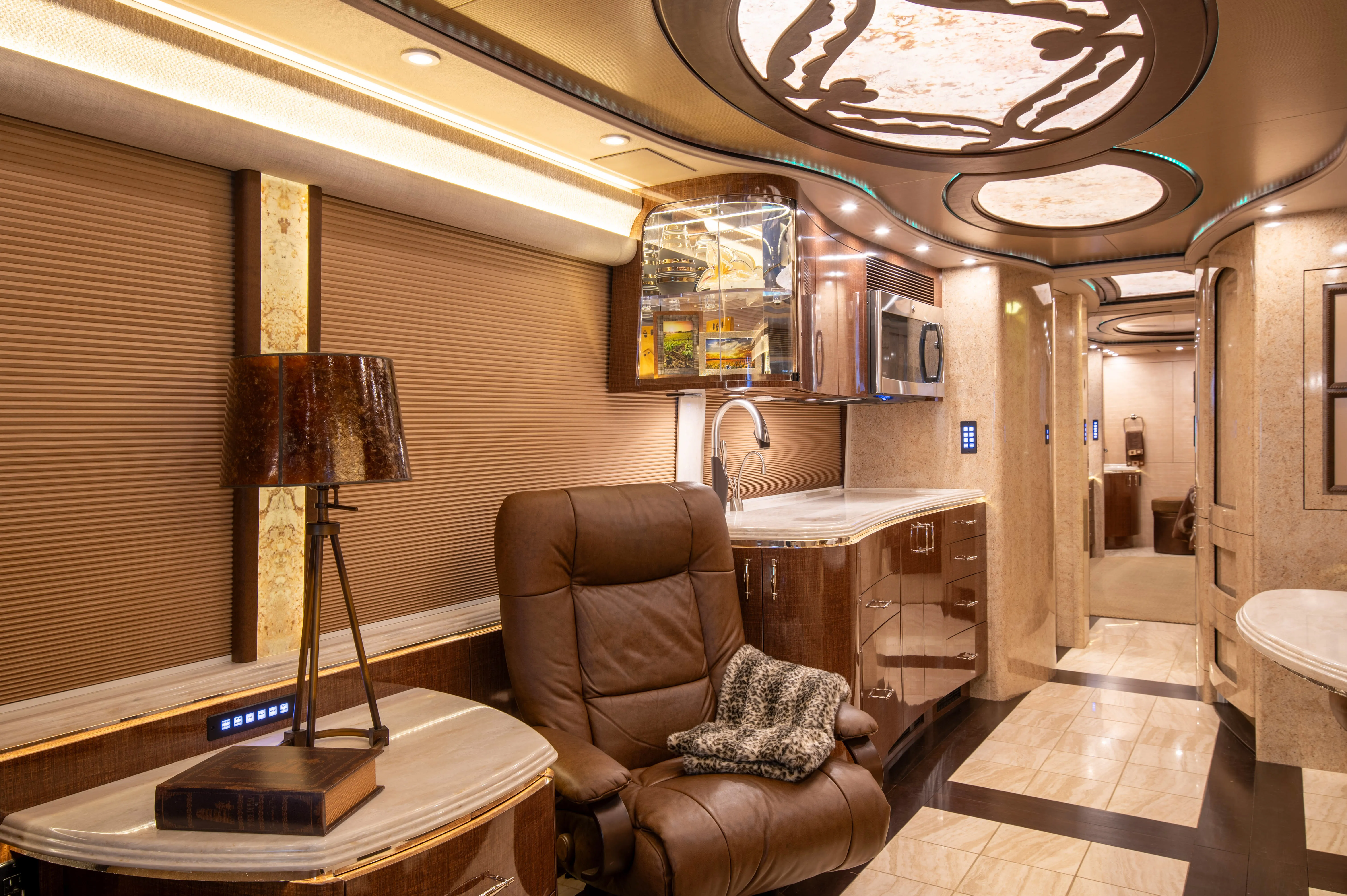 Interior living area with L-shaped leather dinette in Marathon Coach 1219