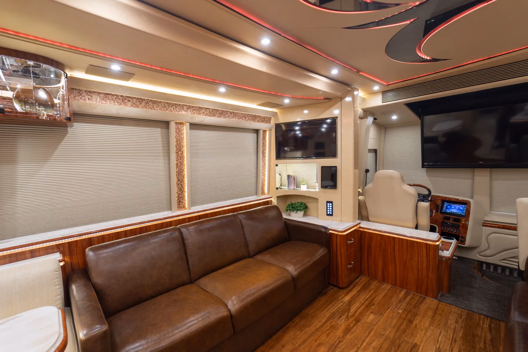 Exterior side view of 2016 Marathon Coach 1225 with ground effects lighting