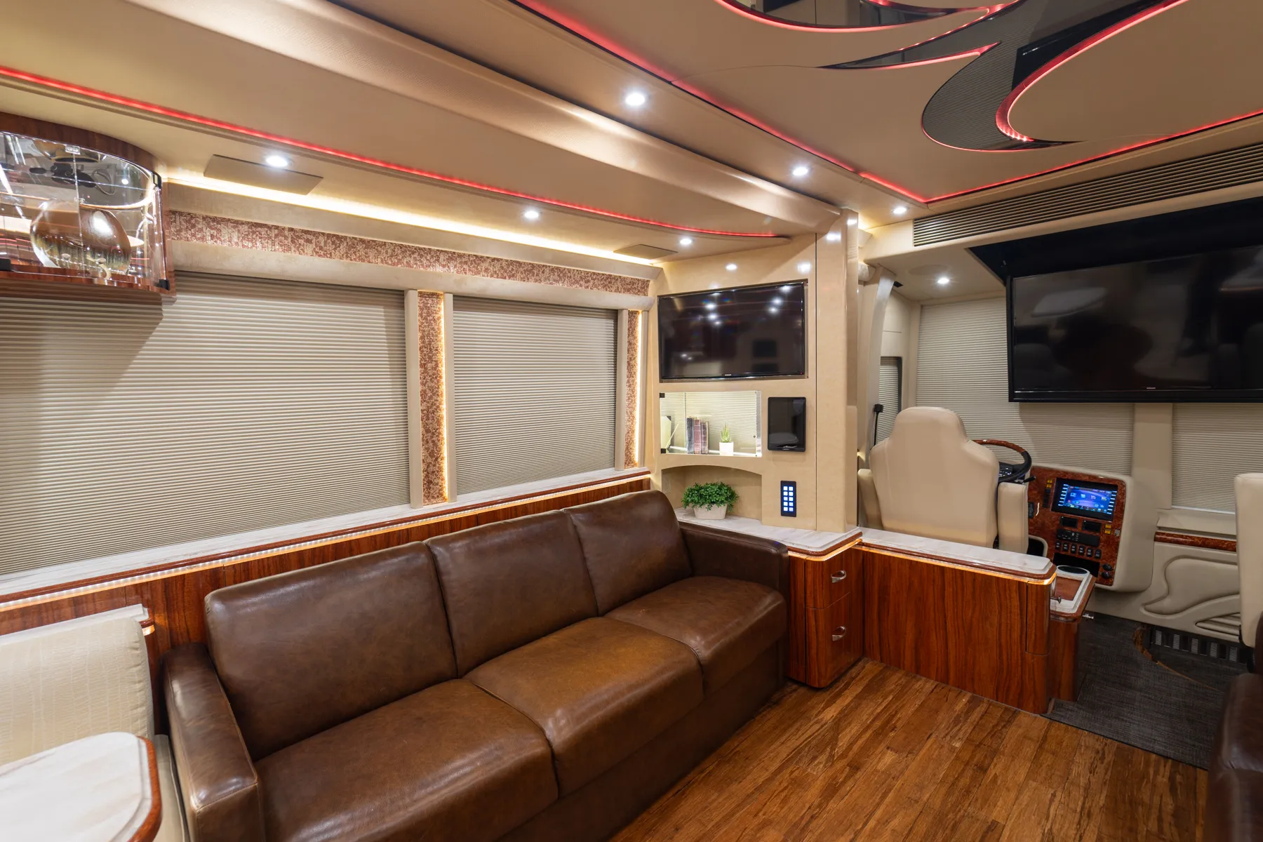 Exterior side view of 2016 Marathon Coach 1225 with ground effects lighting
