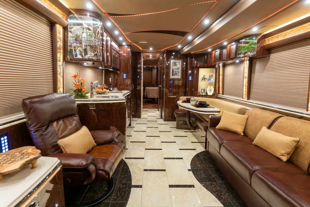 Interior salon of 2020 Marathon Coach 1301 with integrated A/V systems