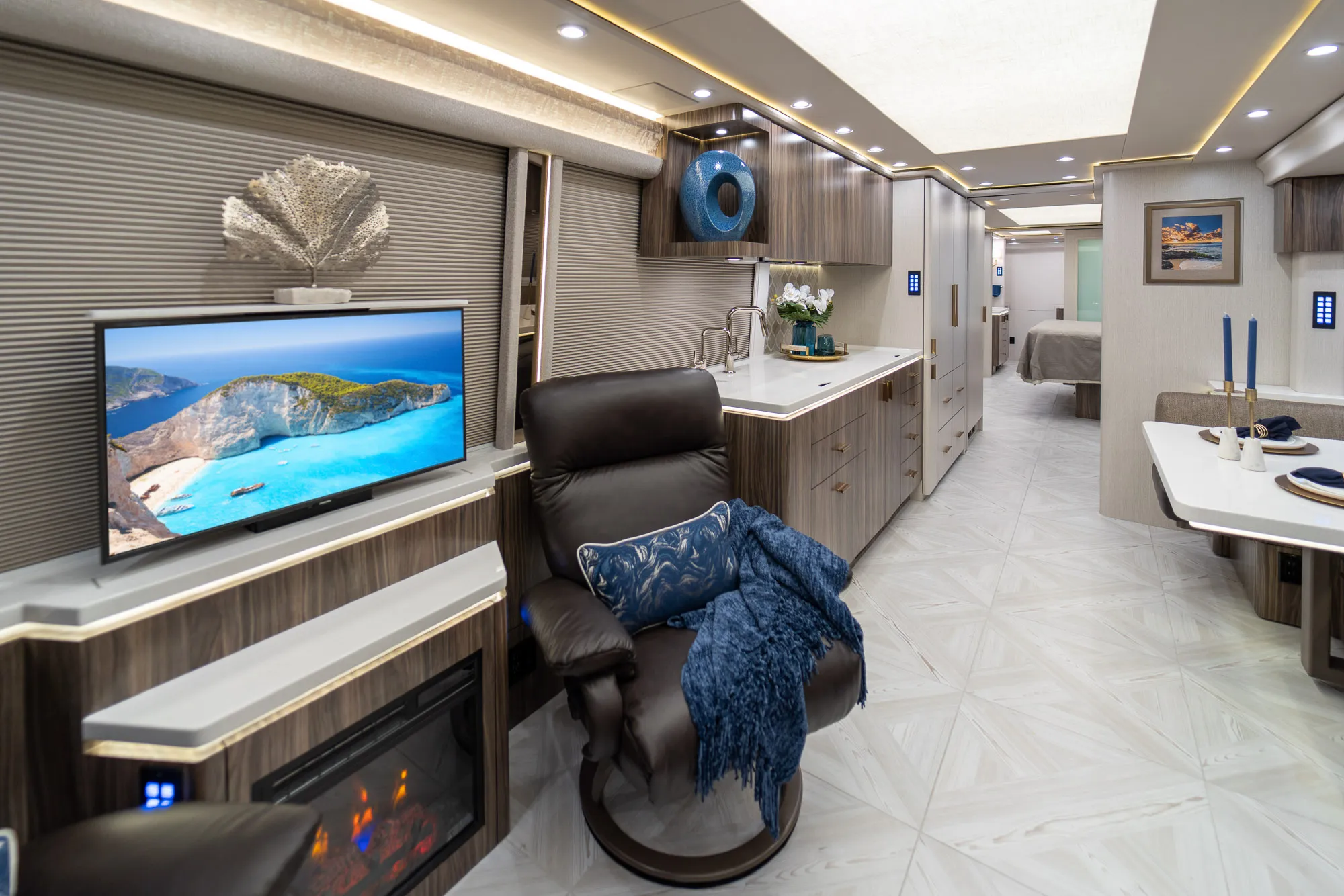 Interior living area of Marathon Coach 1348 with triple-slide open floor plan