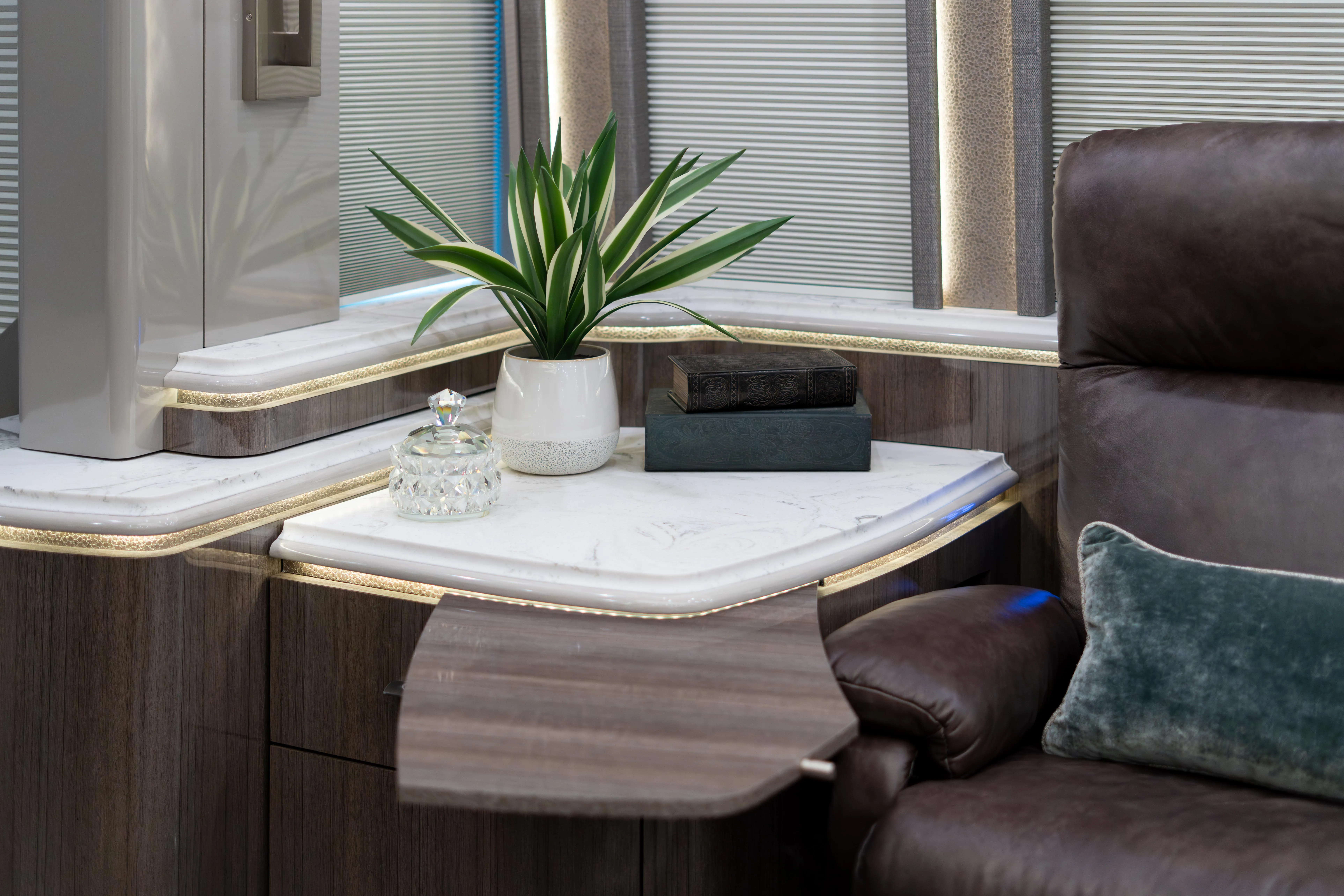 Exterior of 2022 Prevost H3-45 Marathon Coach 1341 with ground effects lighting