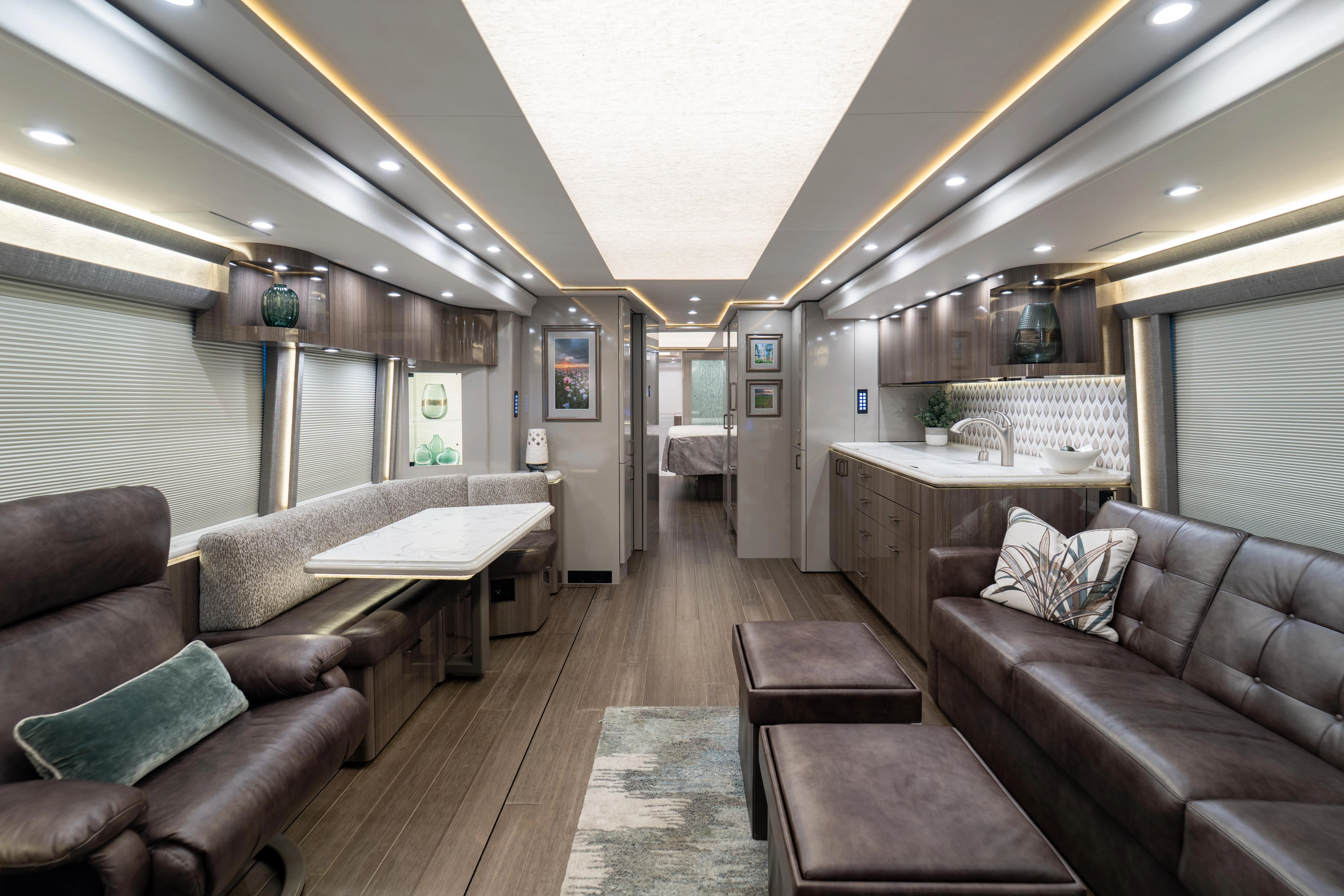 Interior salon of 2022 Marathon Coach 1341 with underfloor heating and quad-slide layout