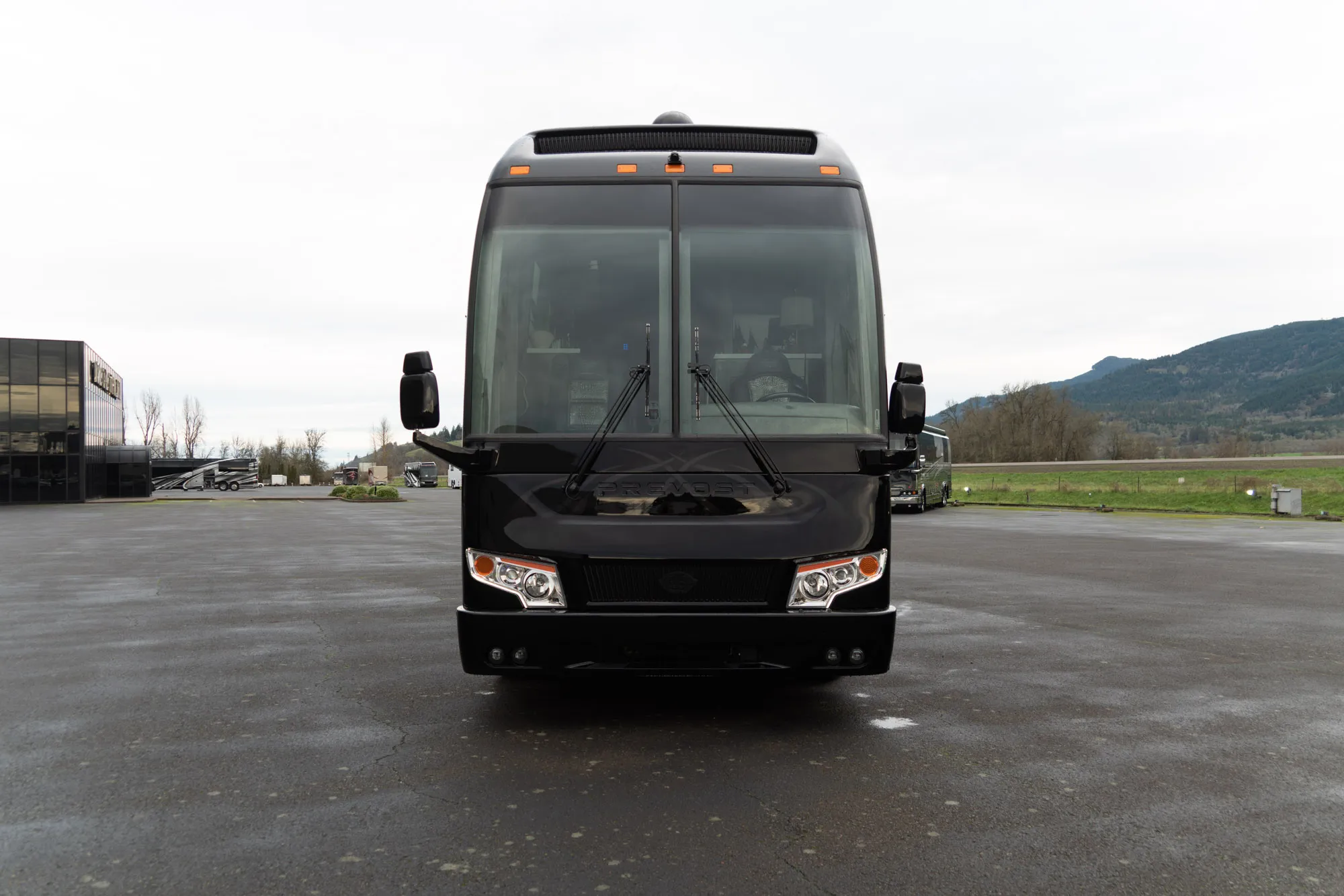 Interior salon of 2022 Marathon Coach 1351 with Crestron surround sound and double-slide layout