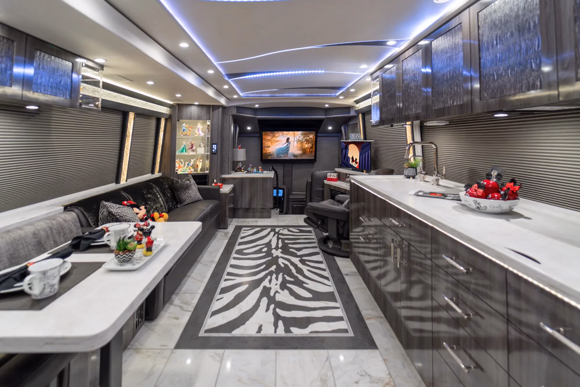 Exterior of 2022 Prevost H3-45 Marathon Coach 1351 with playful custom paint