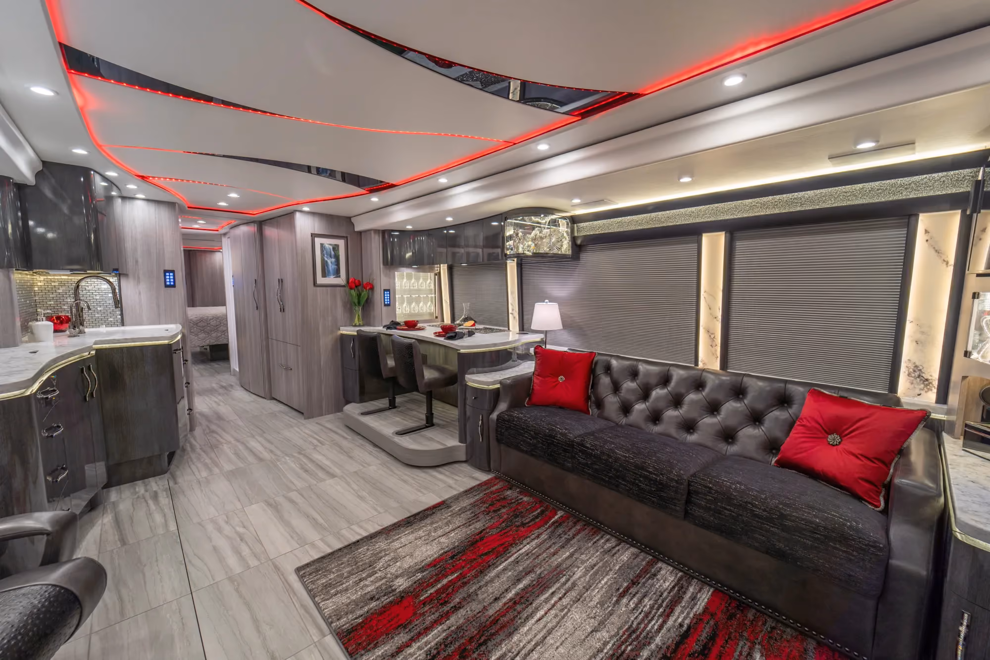 Interior living area of Marathon Coach 1354 with triple-slide open floor plan