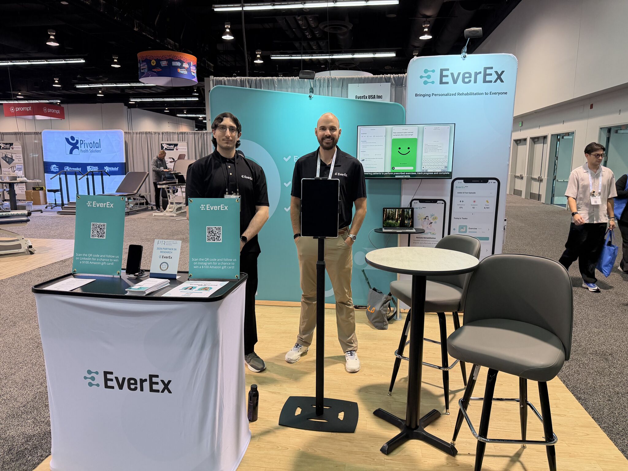 EverEx team members standing together at their CSM conference booth in front of branded signage highlighting Remote Therapeutic Monitoring and care beyond the clinic.