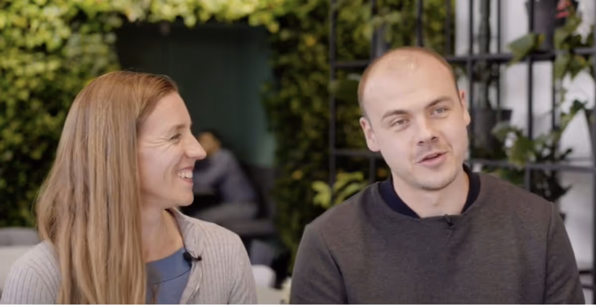 Image of RespiQ Co-Founder Mira Gleisberg smiling and Vitalii Vorkov talking