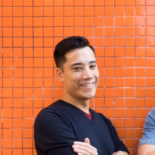 Image of Partner at Think and Grow Anthony Sochan in front of tile wall
