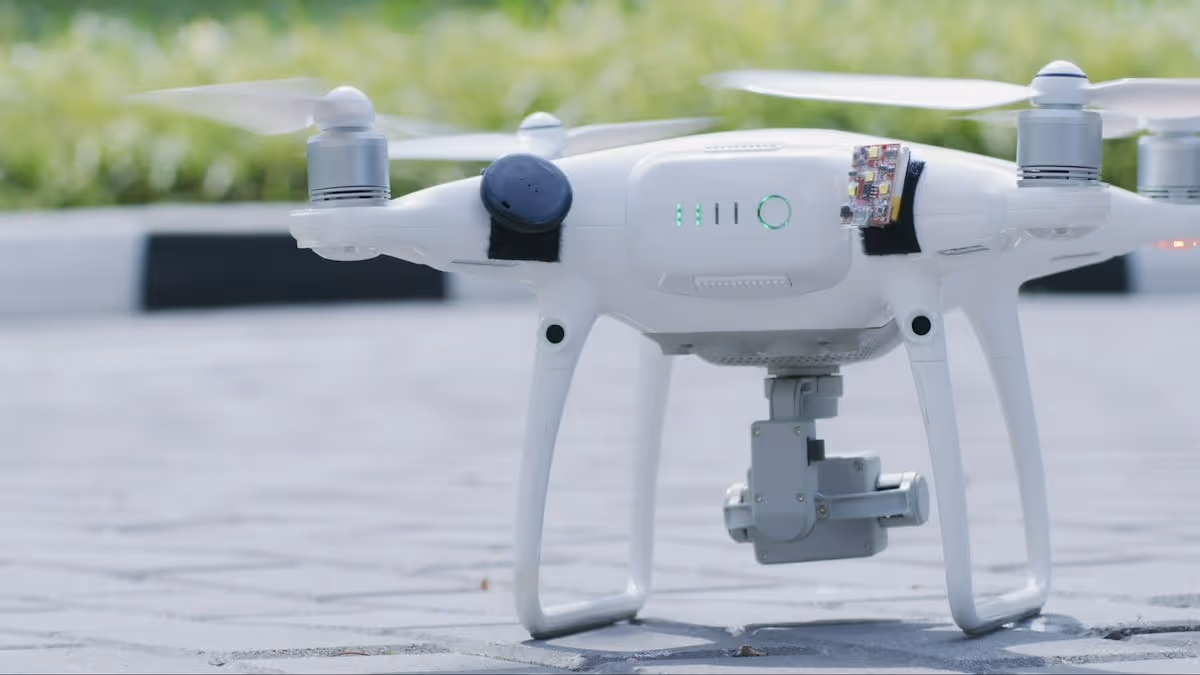 White drone about to take flight with grass in the background