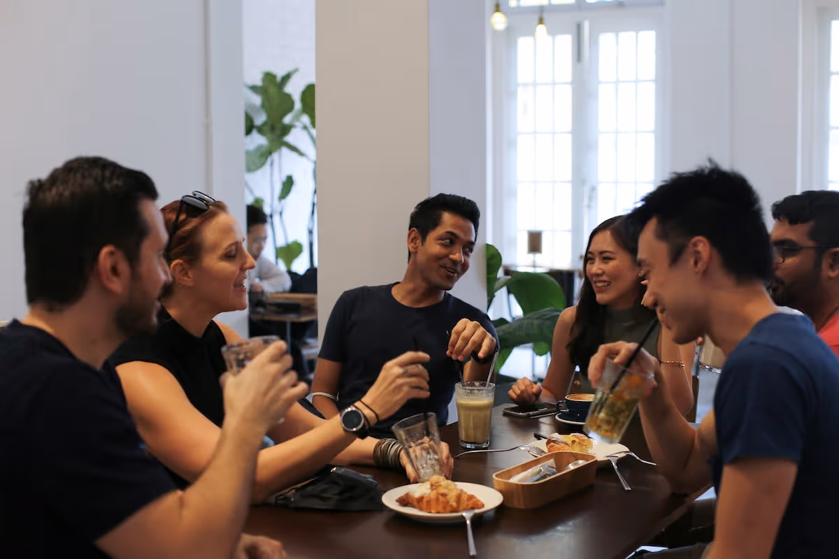 A group of people at Soda participating in a huddle session