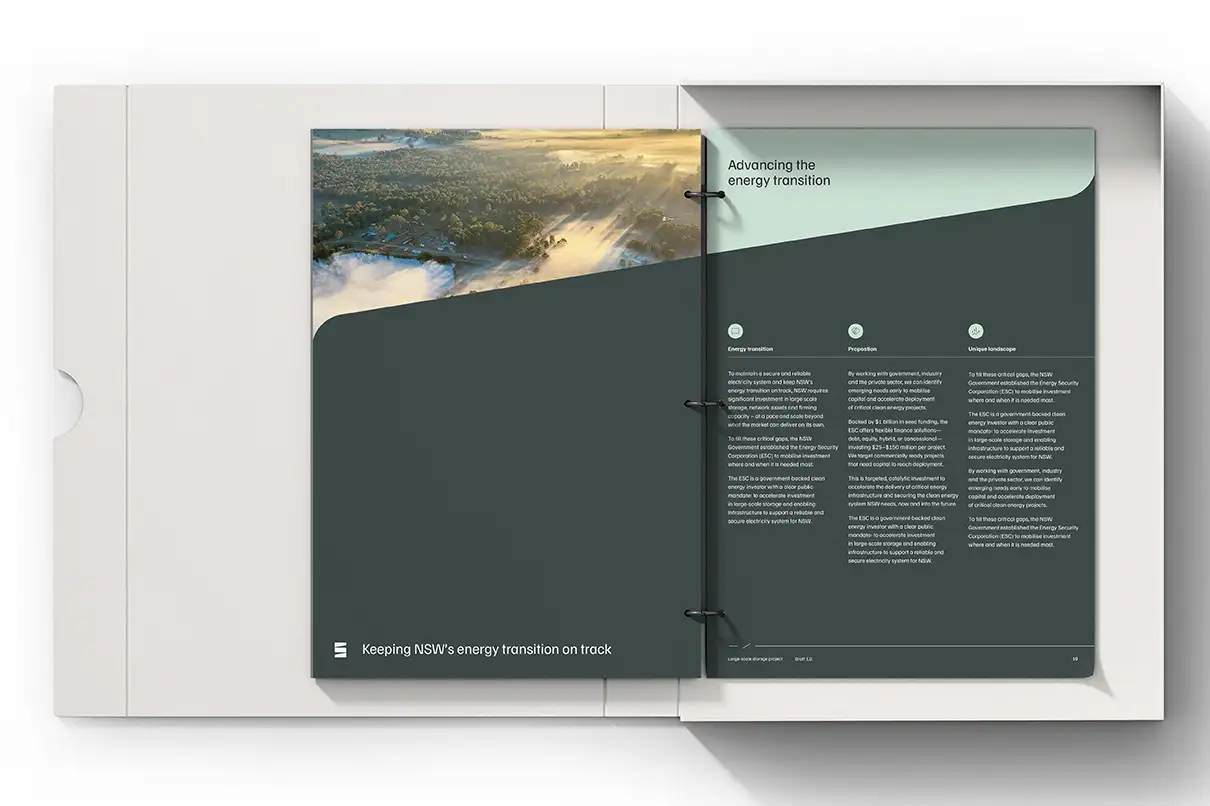 Open binder showing two pages: left with a landscape photo at the top and text 'Keeping NSW’s energy transition on track' below; right page titled 'Advancing the energy transition'.