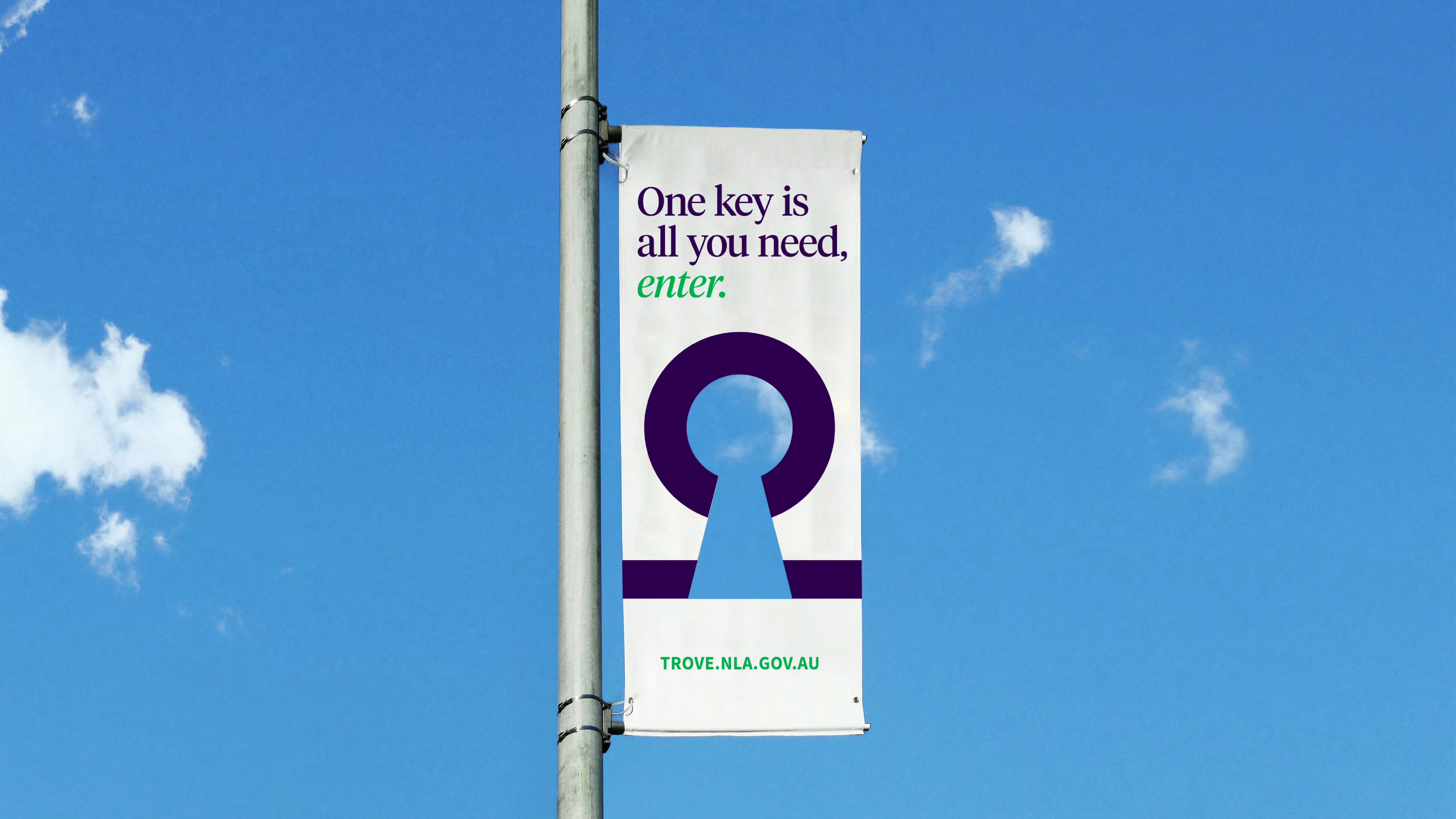 Street pole banner with the Trove keyhole symbol and the tagline ‘One key is all you need, enter.’