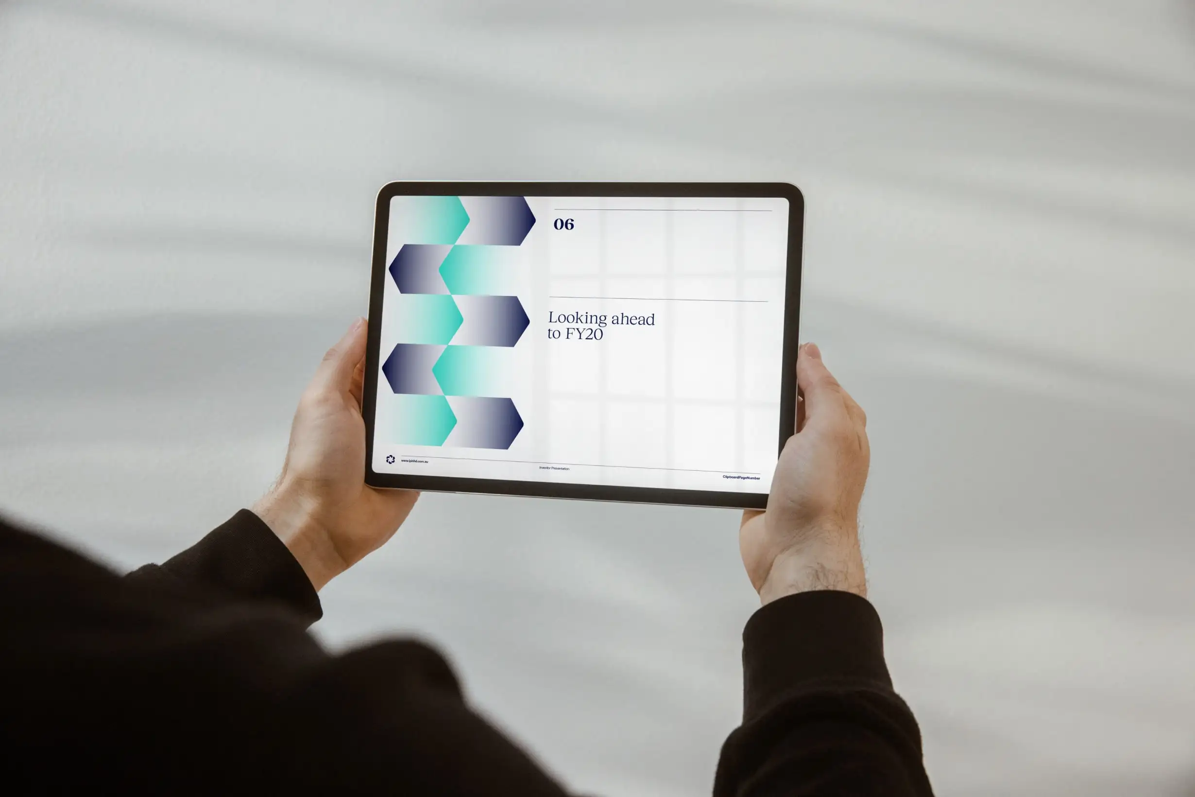 Person viewing an IPH presentation slide showing the brand’s forward-looking growth message.