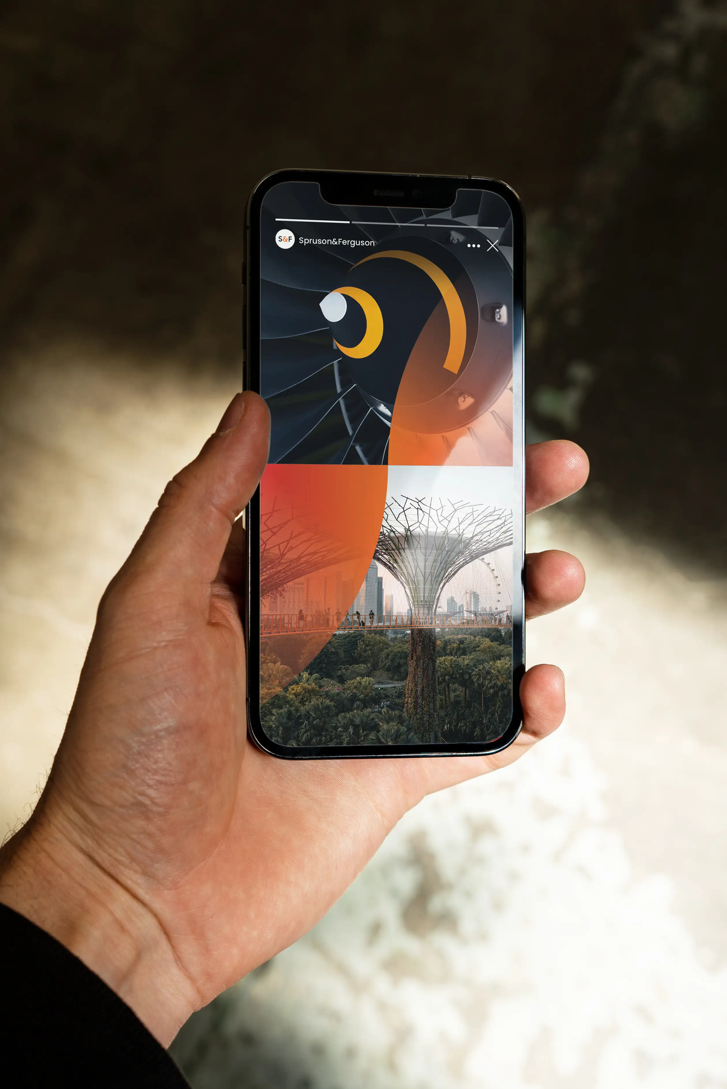 A person holding a smartphone displaying a Spruson & Ferguson Instagram Story.