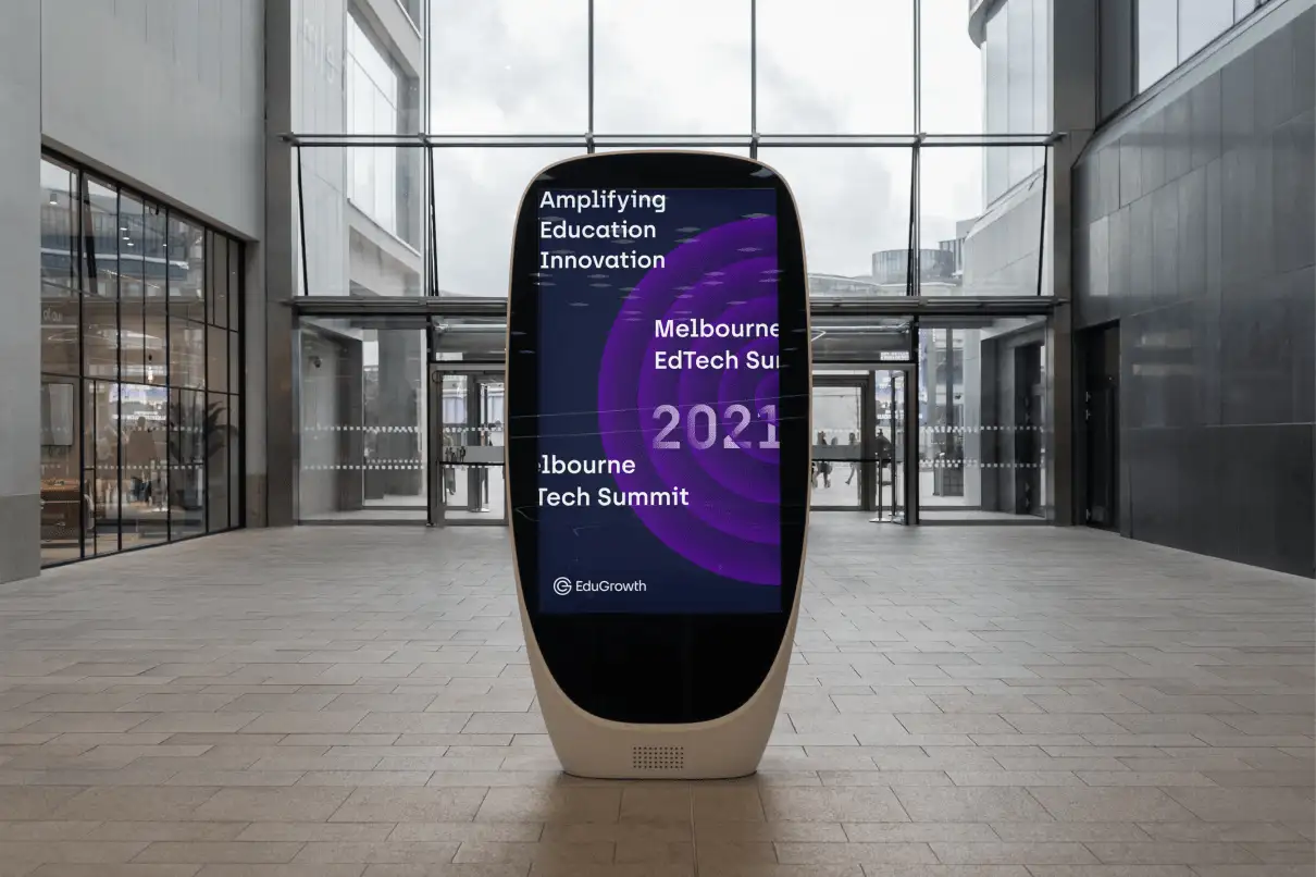 Digital kiosk displaying poster for Melbourne EdTech Summit 2021.