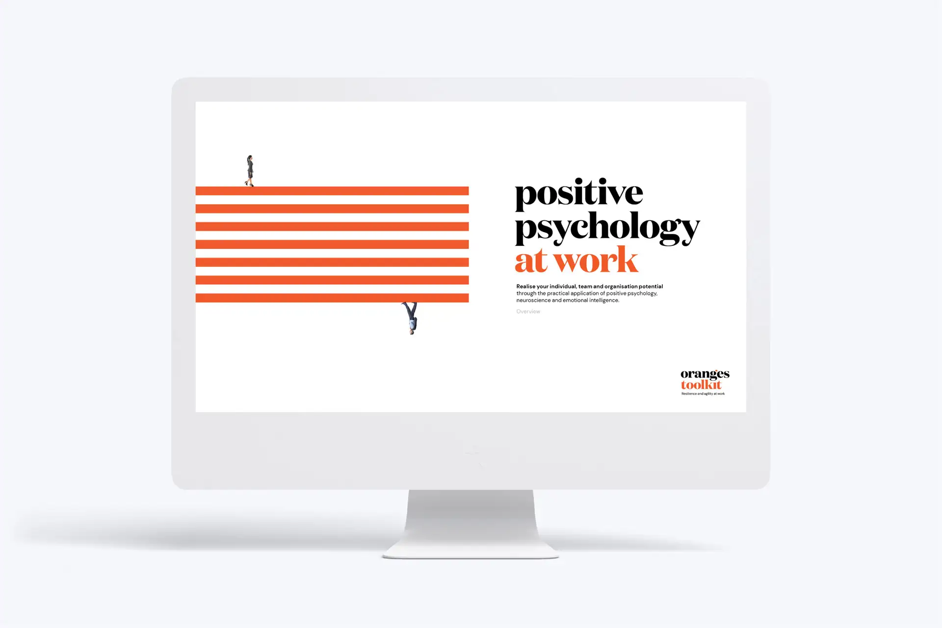 Computer screen displaying a presentation titled 'positive psychology at work' with orange stripes and small business people graphics.