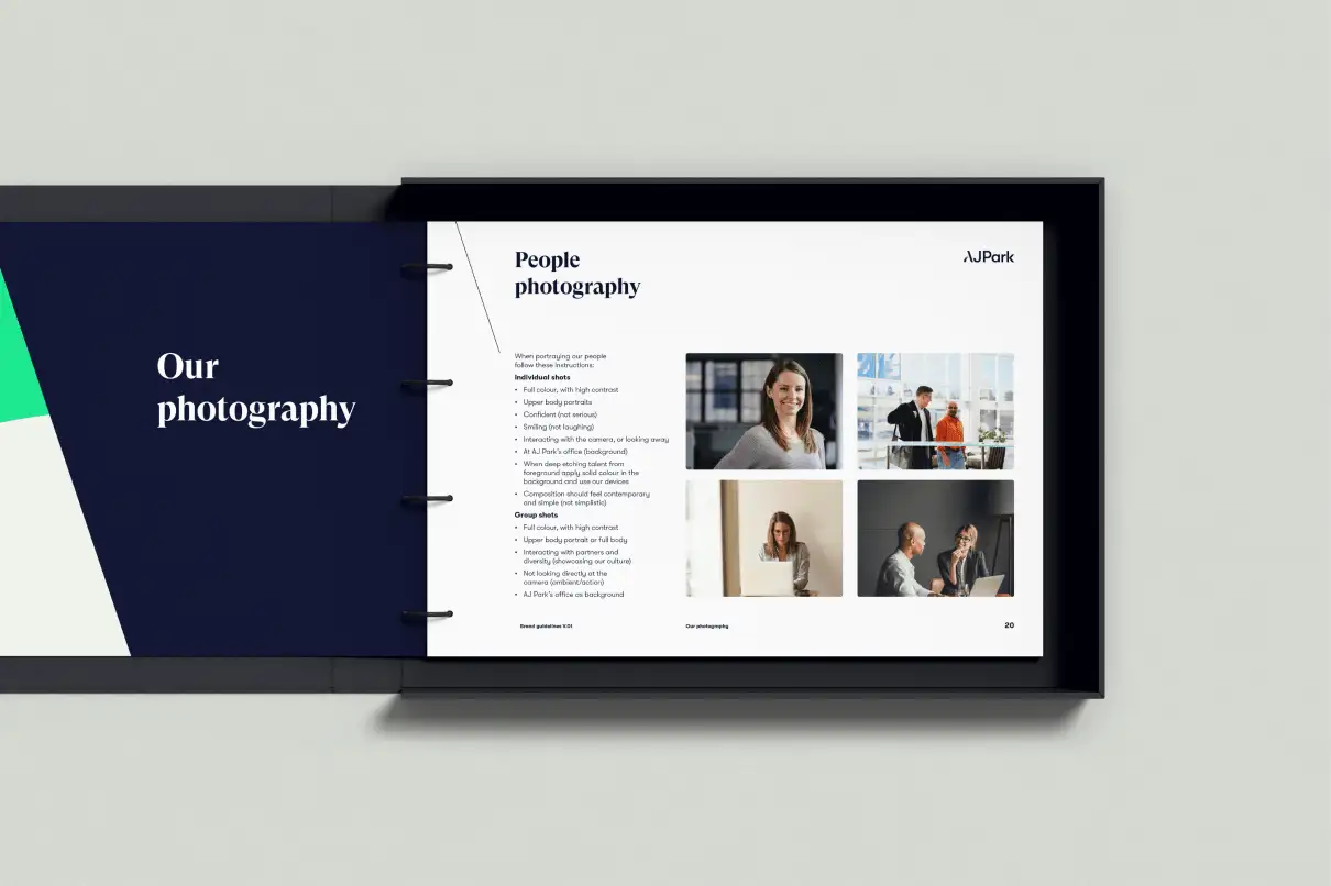 Hands holding an open AJ Park booklet showing the contents page on the left and introductory text on the right.