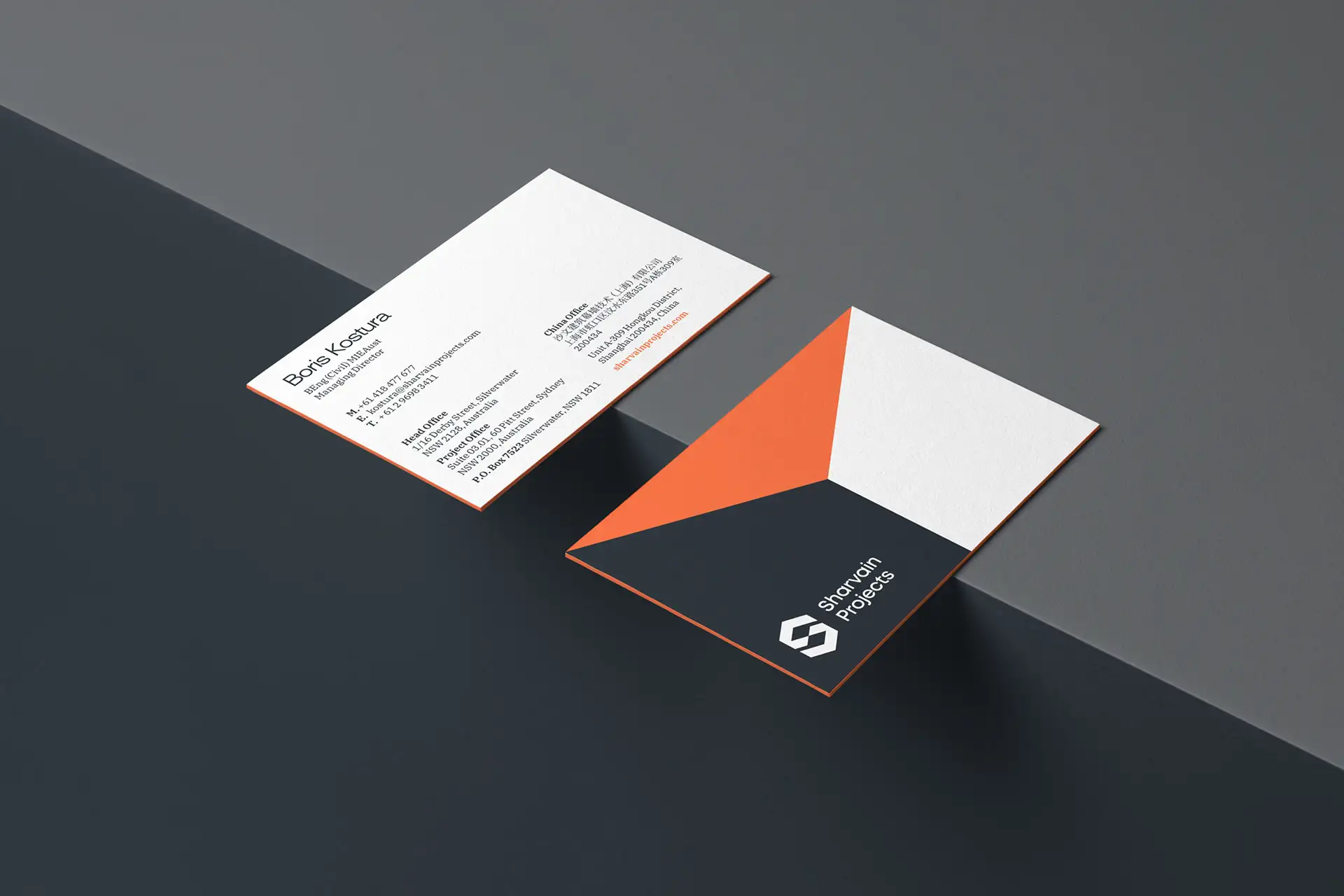 Two modern business cards for Sharvain Projects with geometric designs.