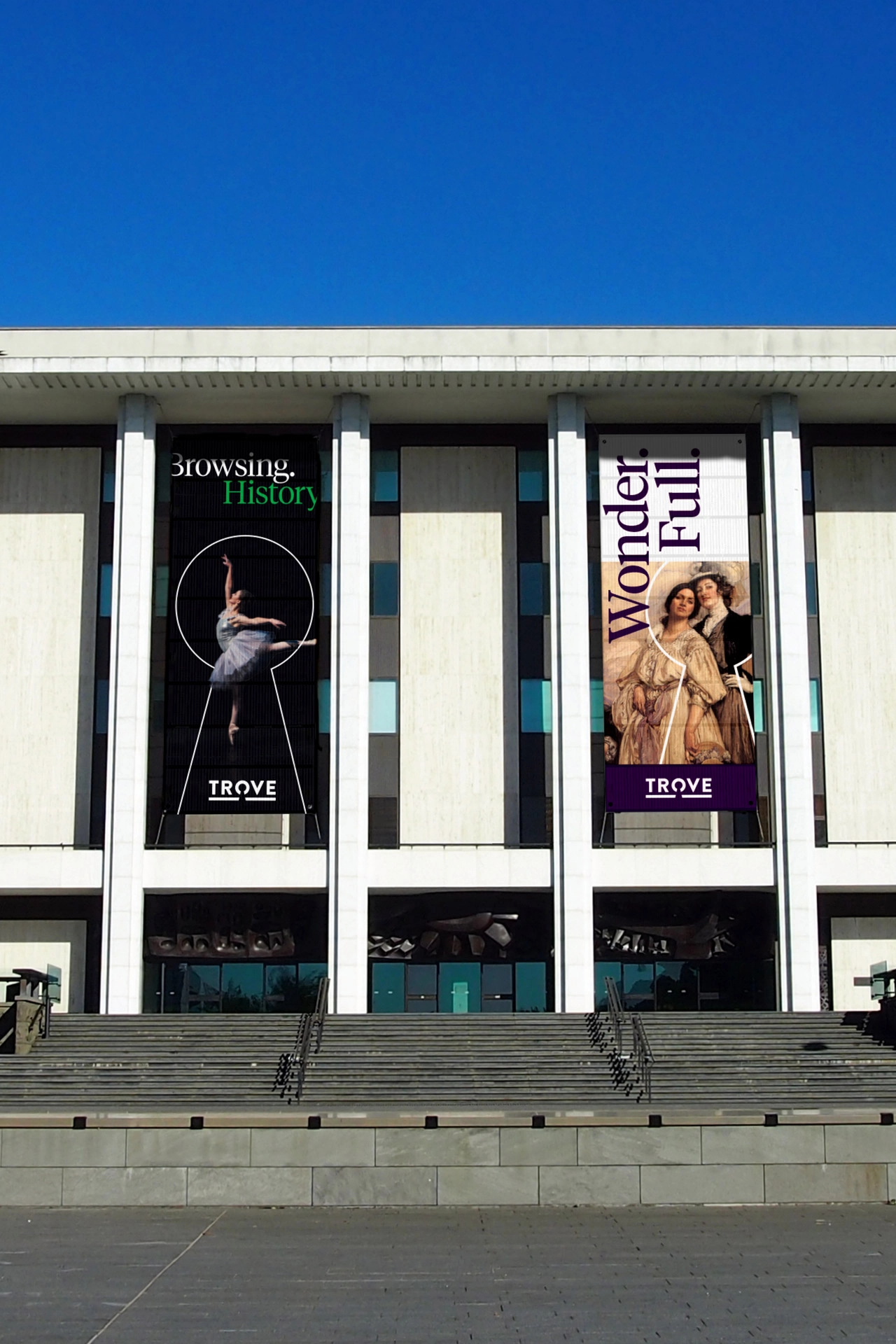 Exterior of the National Library of Australia with two large vertical Trove campaign banners.