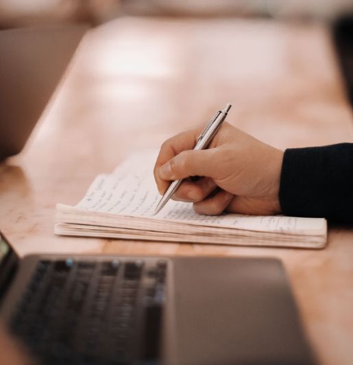 writing notes in notebook