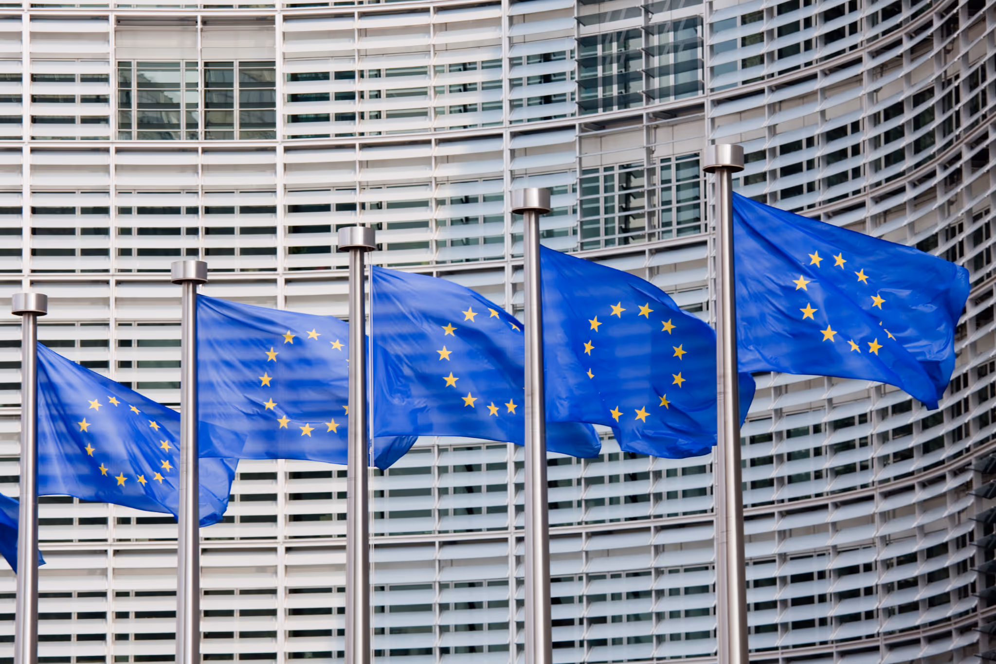 European Union flags in front of the European Commission building in Brussels