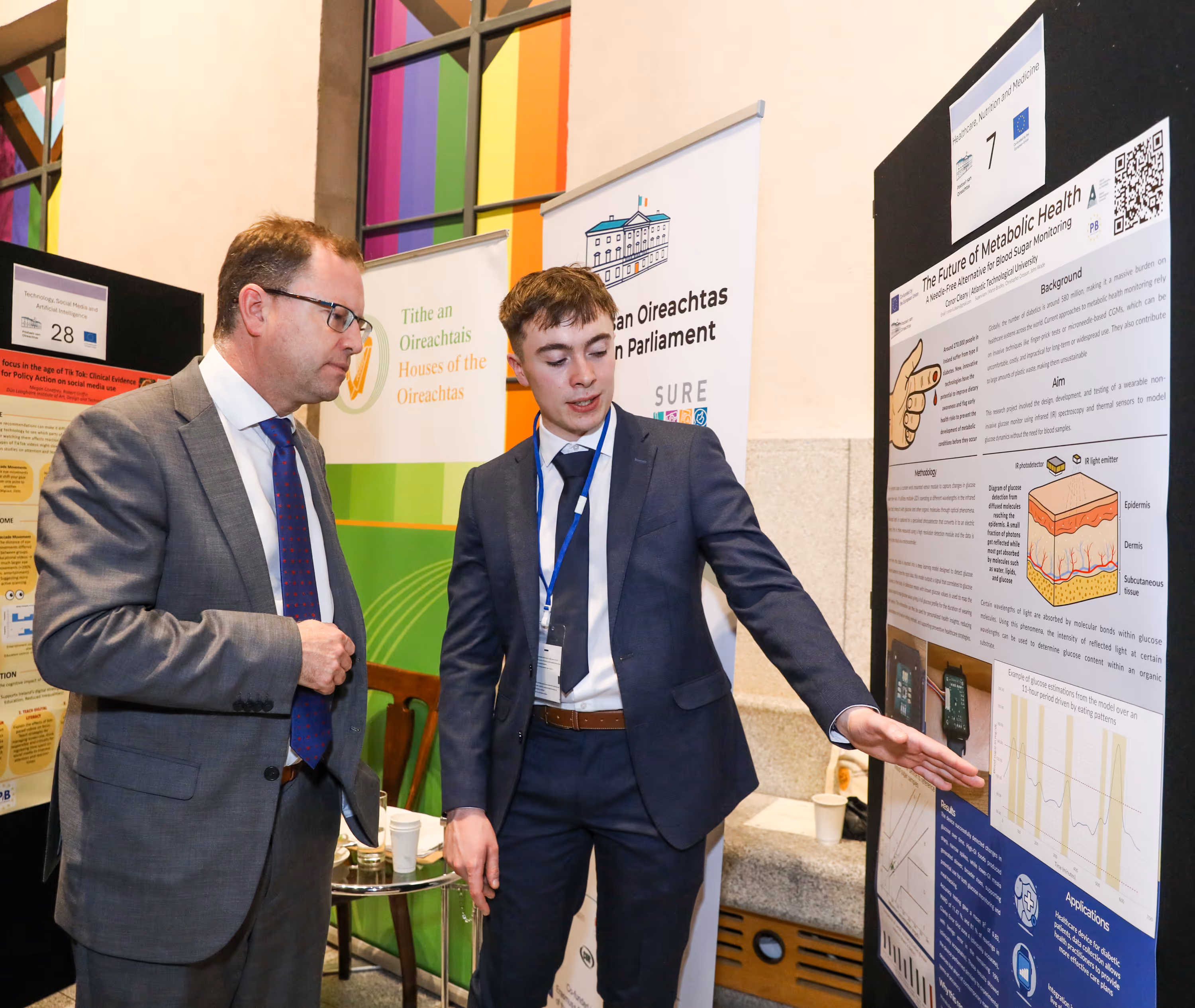 Minister James Lawless TD speaking with ATU student Conor Cleary