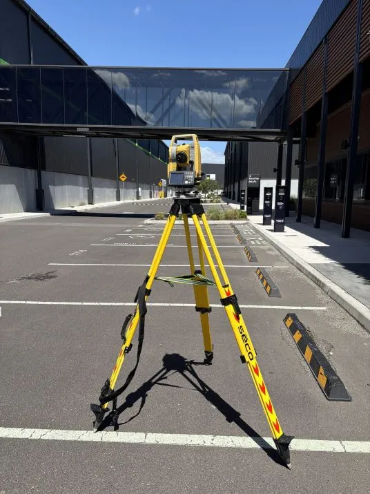 Total station set up on an industrial site