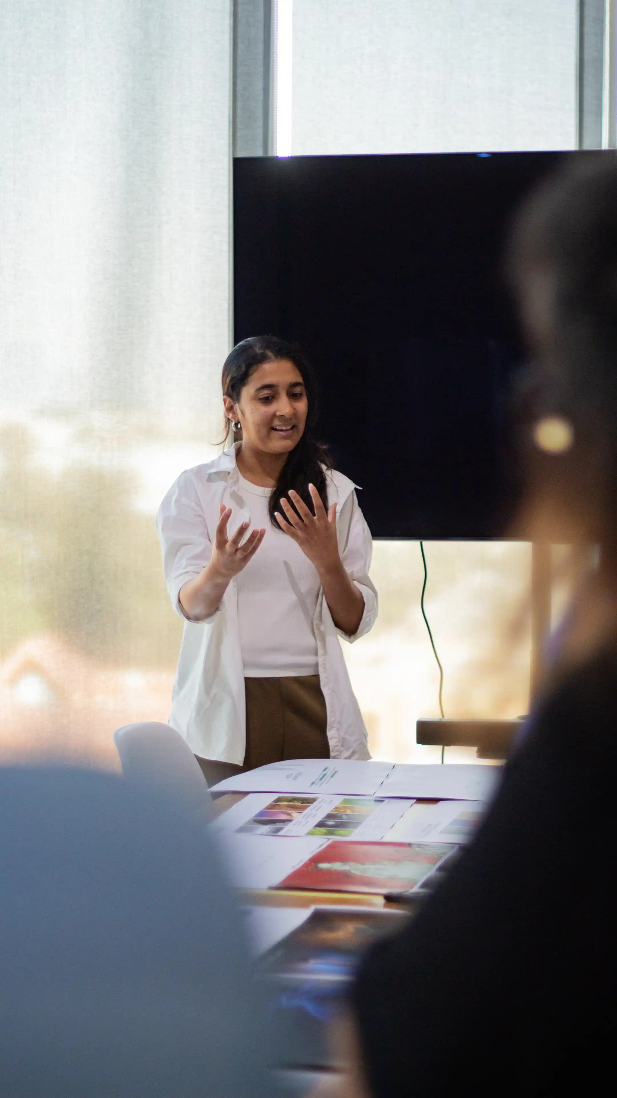 LIMAH designer presenting an experiential design concept to the team