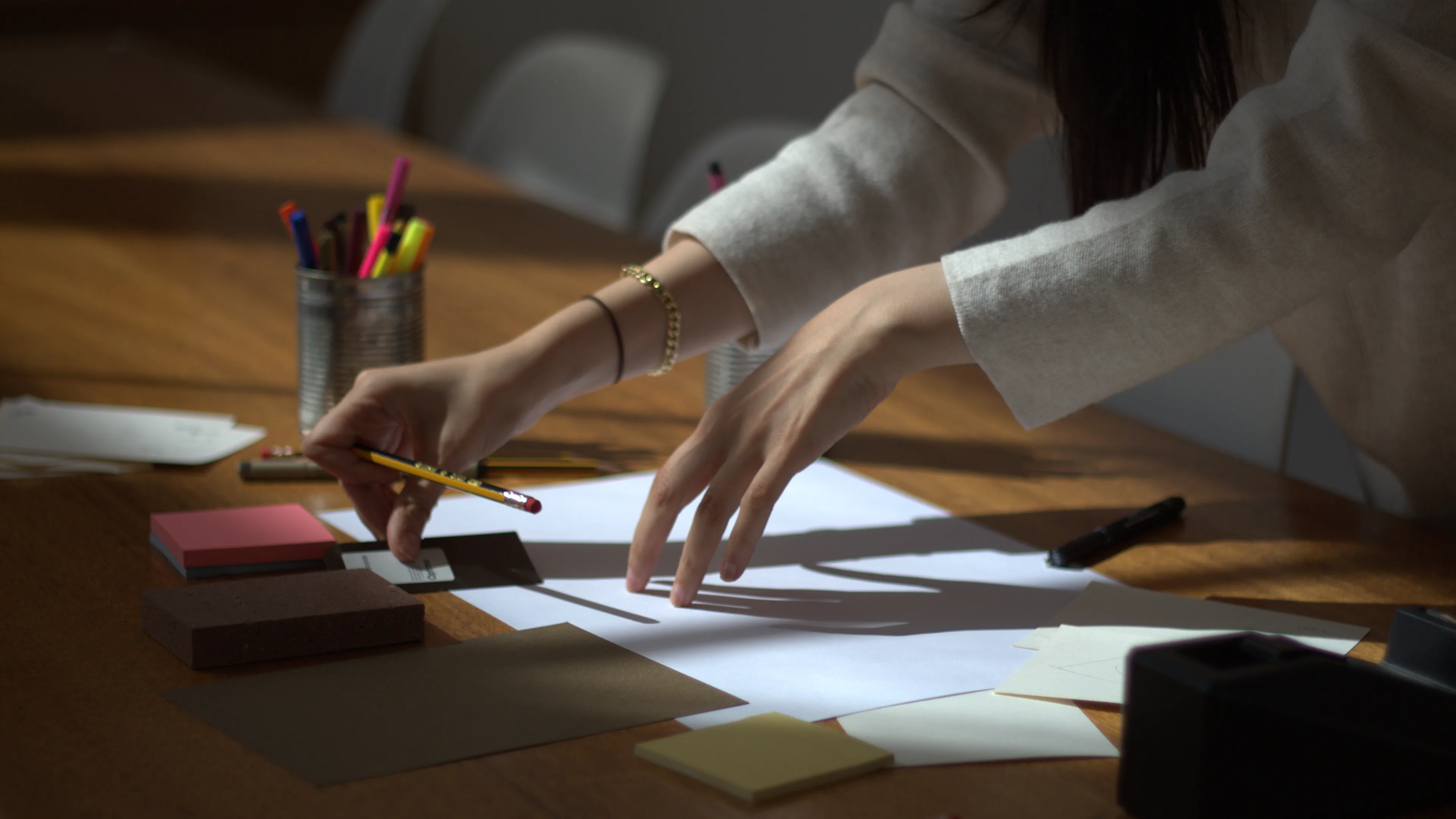 Close up of a LIMAH designer testing materials and colour combinations