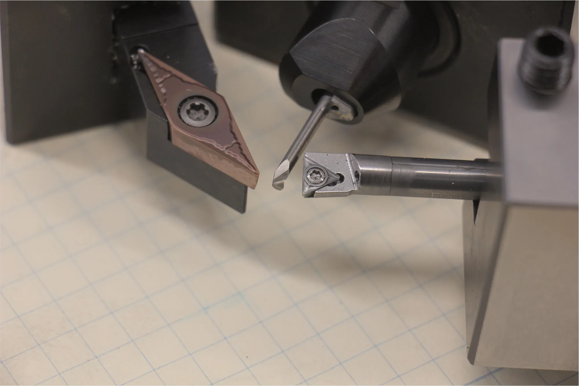 Precision indexable carbide cutting tools and inserts used in CNC machining and turning, illustrating the professional-grade equipment and high-quality materials utilized for rapid prototype fabrication.