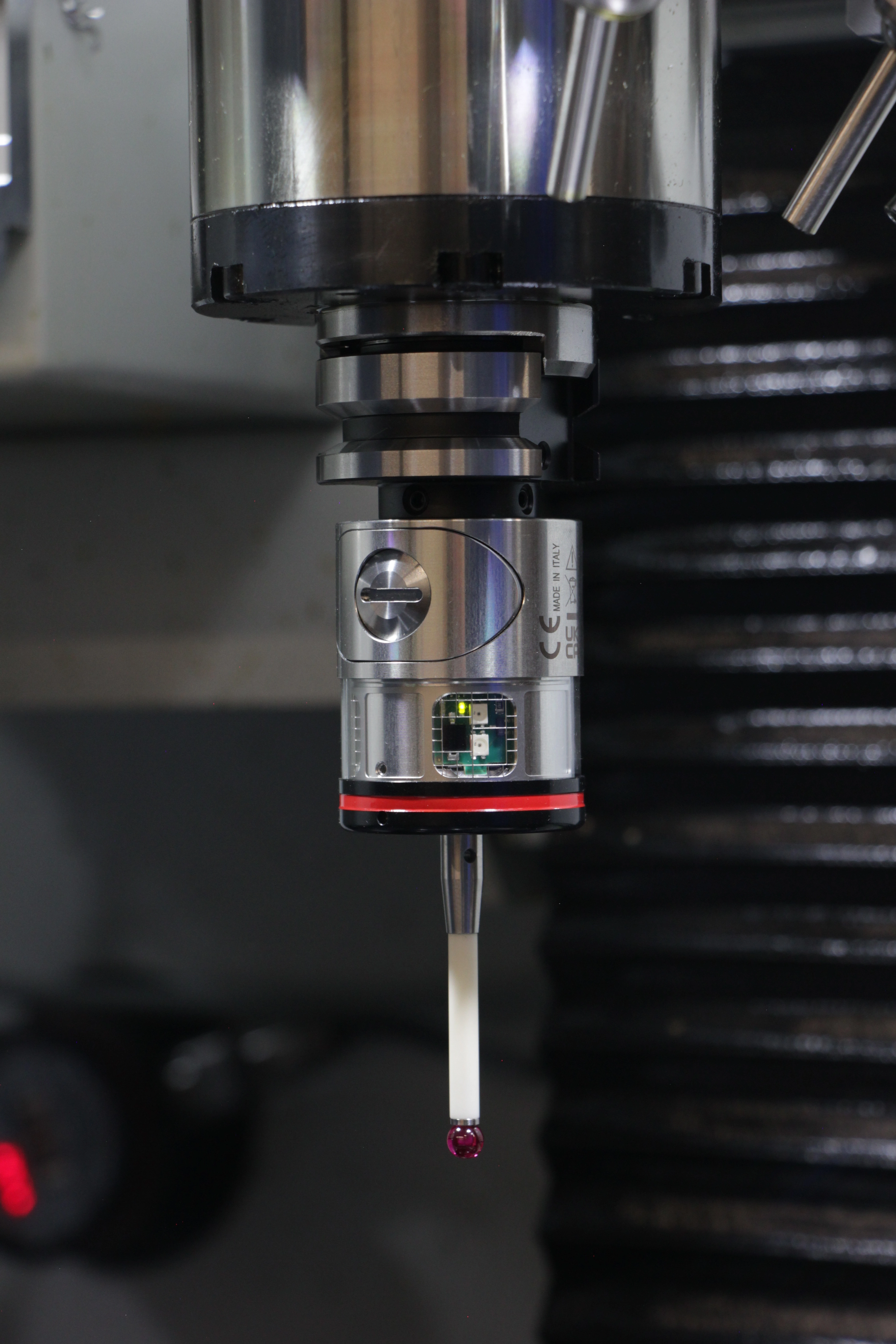 An electronic touch probe mounted in a machine spindle