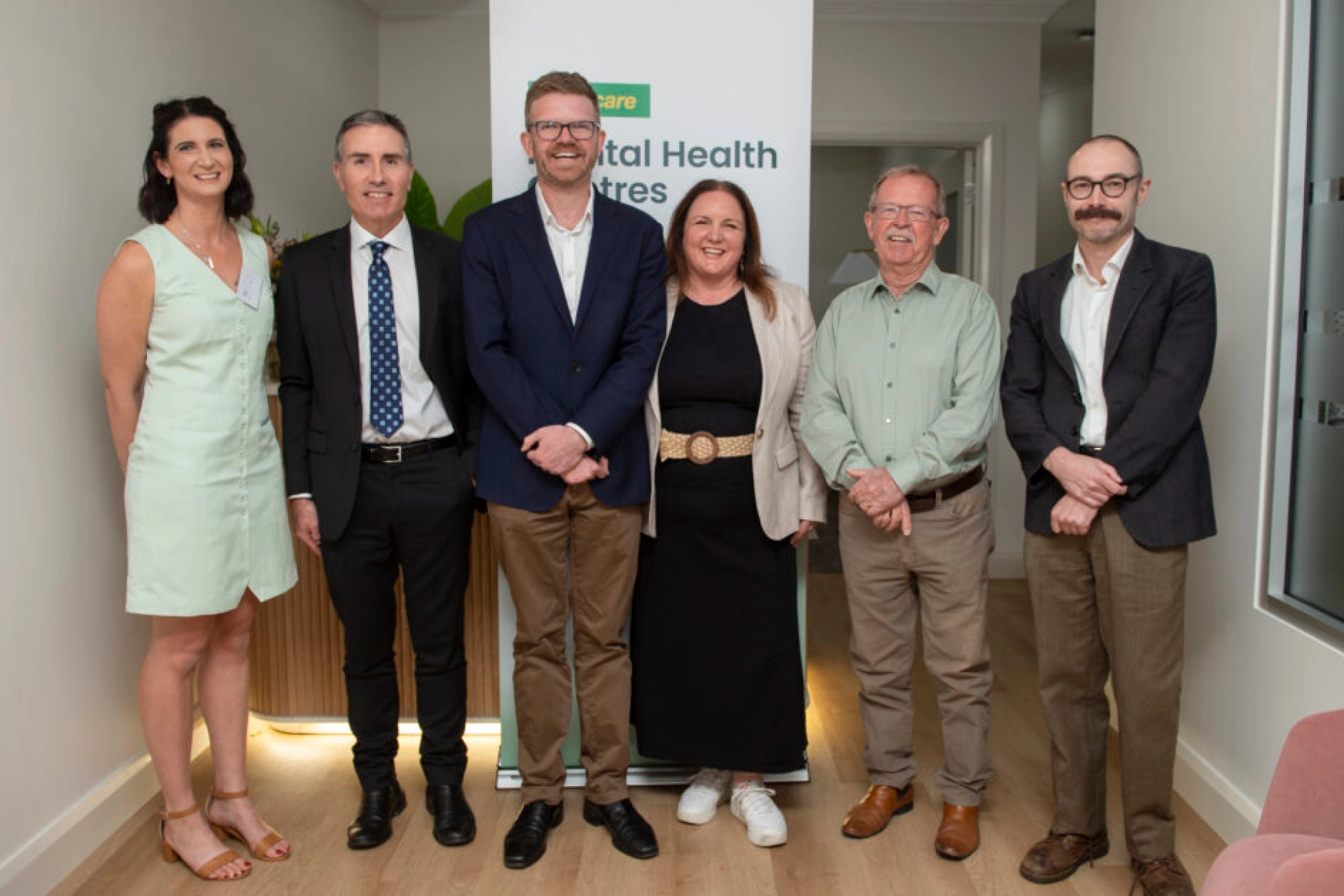 Project representatives standing together at the launch of the Medicare Mental Health Centre.