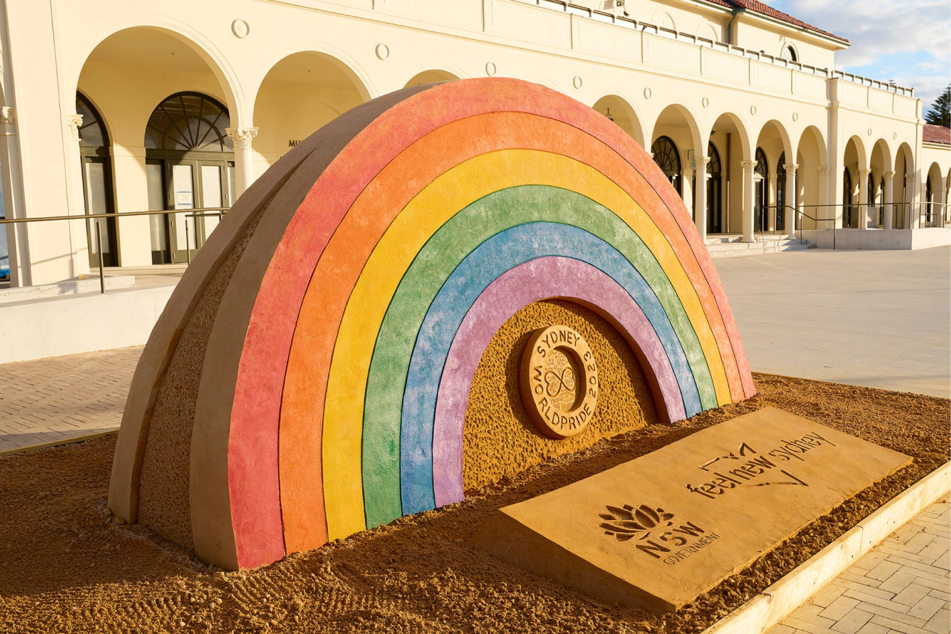 Large rainbow sculpture installed at Bondi Pavilion for Sydney WorldPride 2023 with a First Nations–inspired design.
