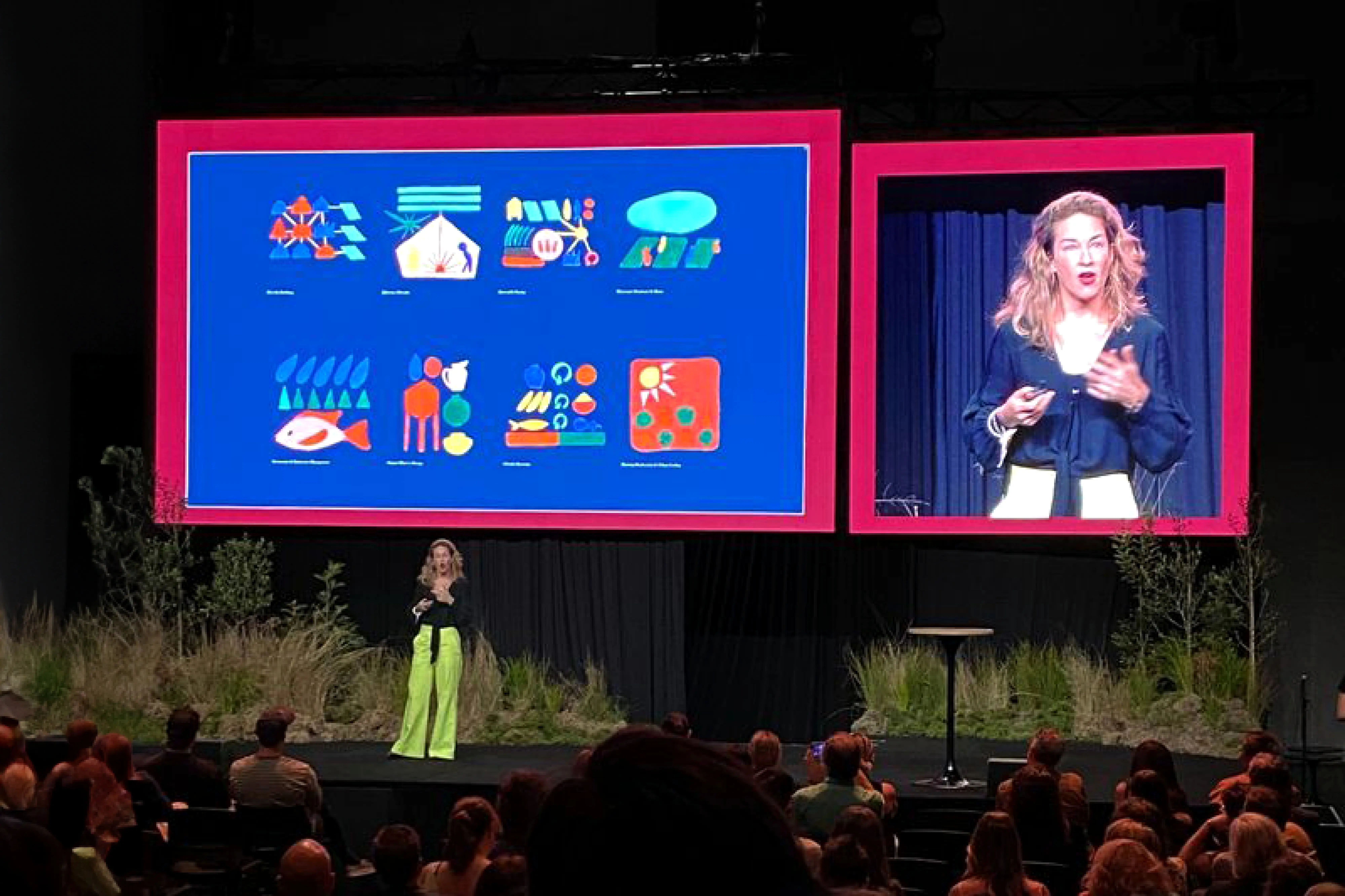 Speaker presenting illustrated frameworks for sustainable futures at Purpose Conference 2023, showing systems thinking and regenerative practices.