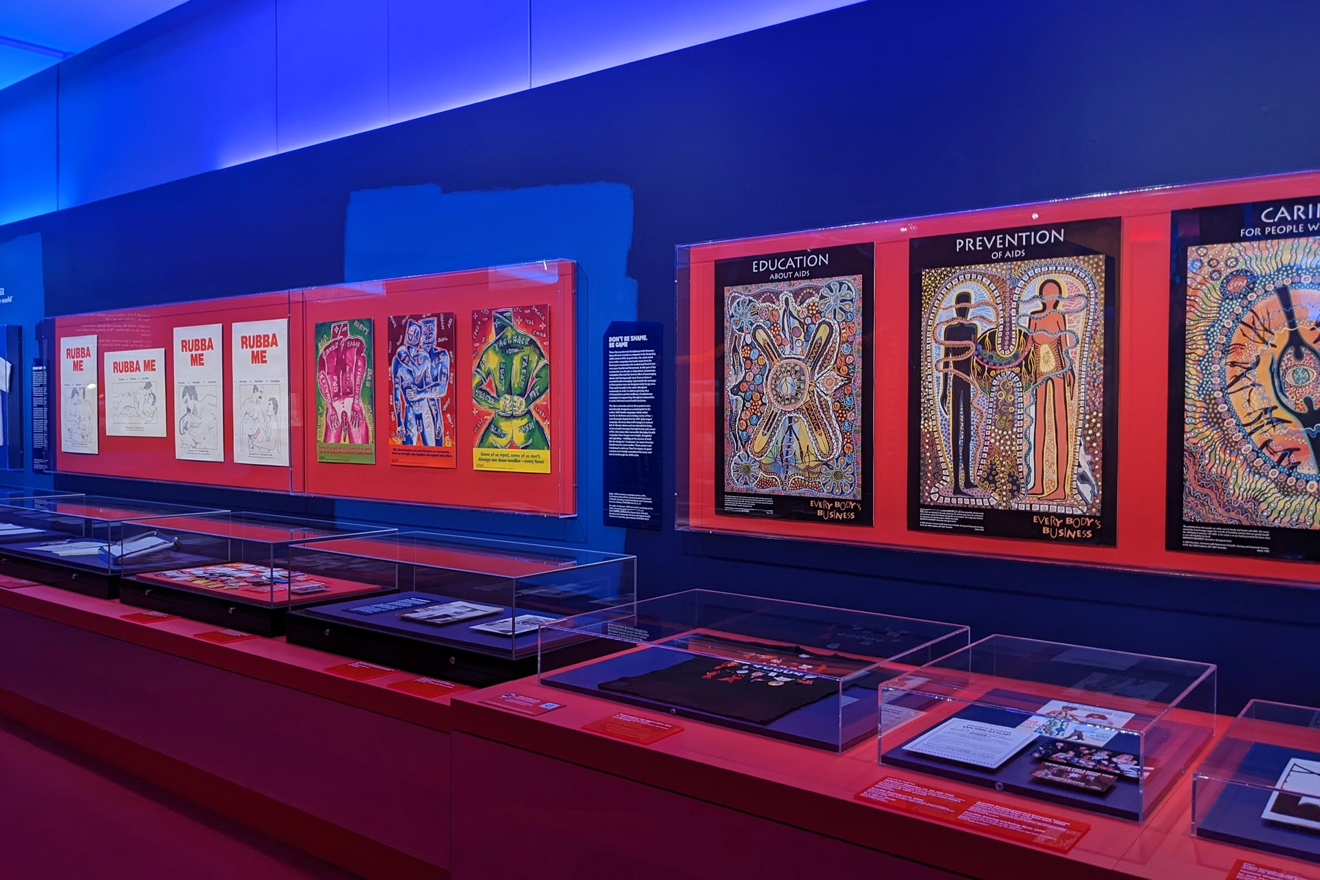 Exhibition display of queer graphic design posters at the ‘Designed with Pride’ showcase.