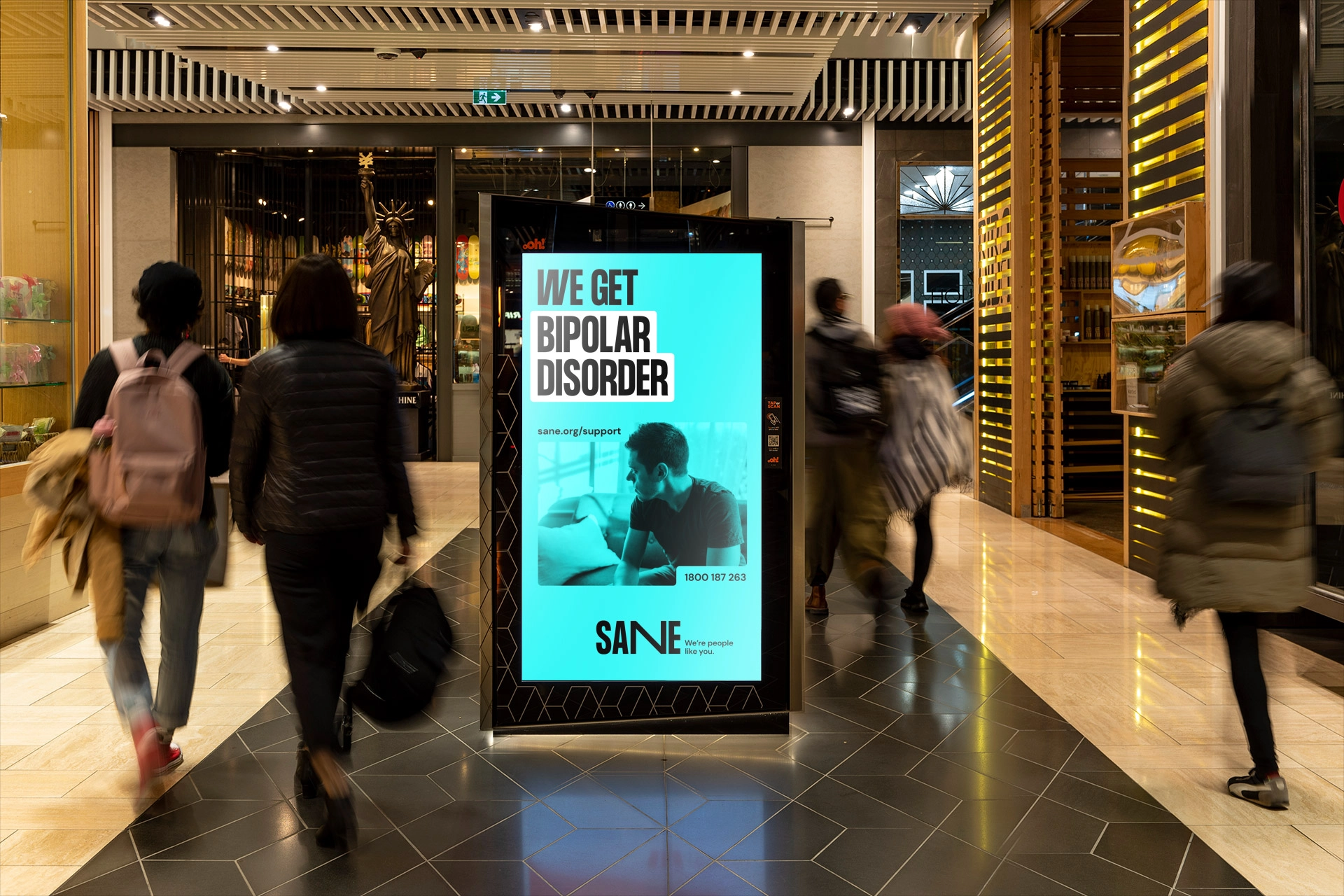 Digital billboard in a shopping centre displaying SANE’s ‘We Get’ mental health campaign.