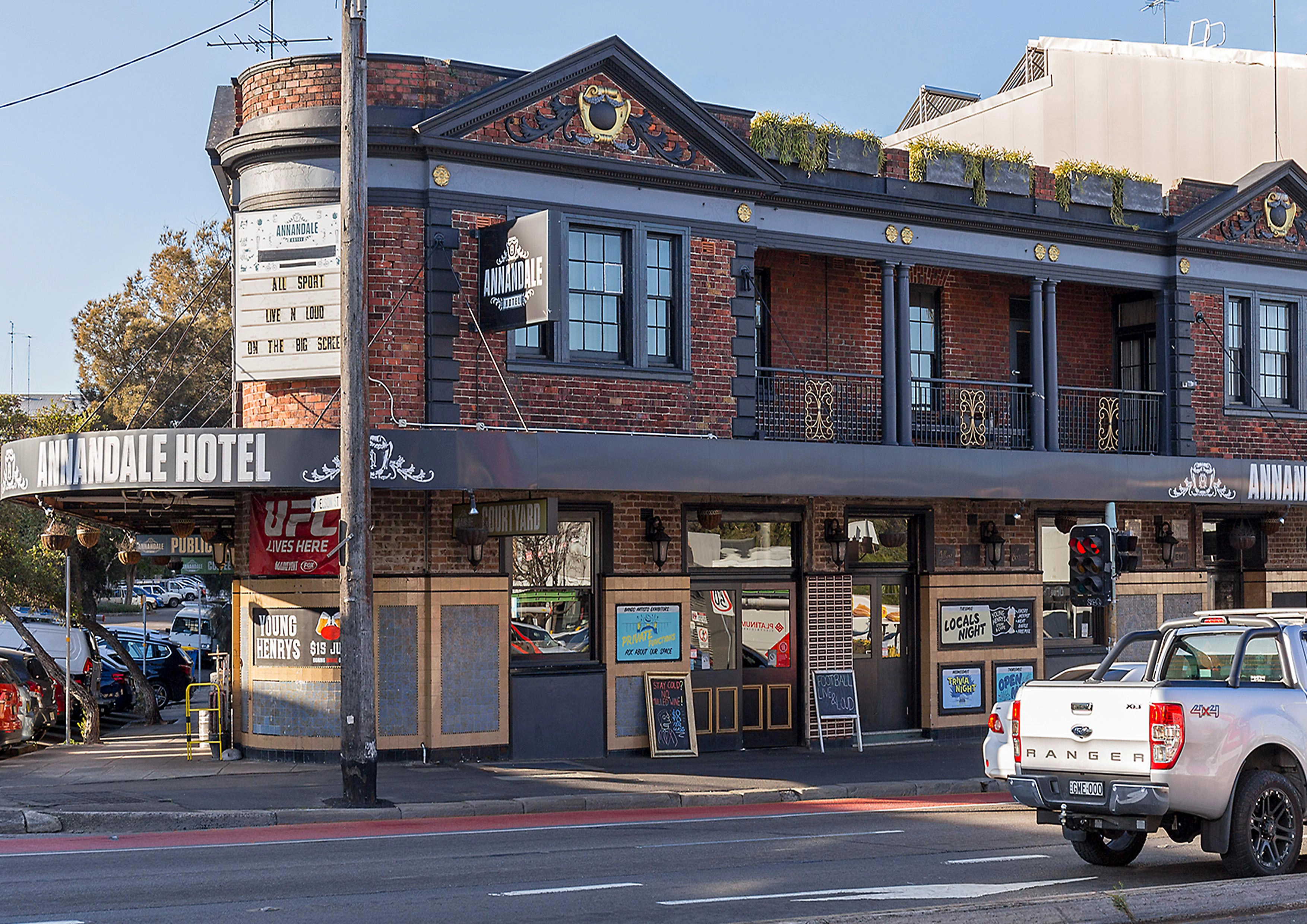 Street view of the Annandale Hotel showing its corner façade and signage.