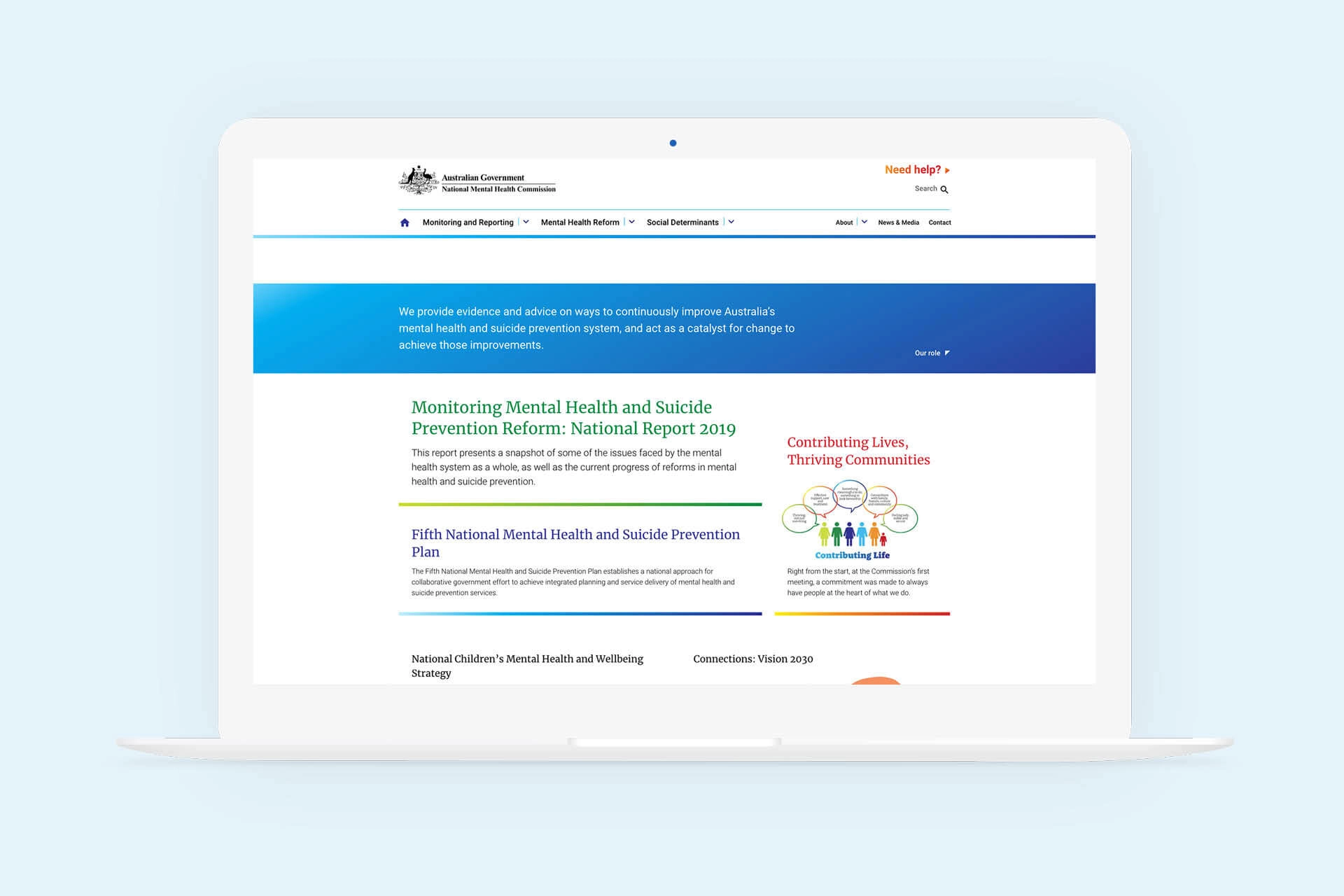 Laptop showing the National Mental Health Commission website homepage, featuring report links and mental health reform information.