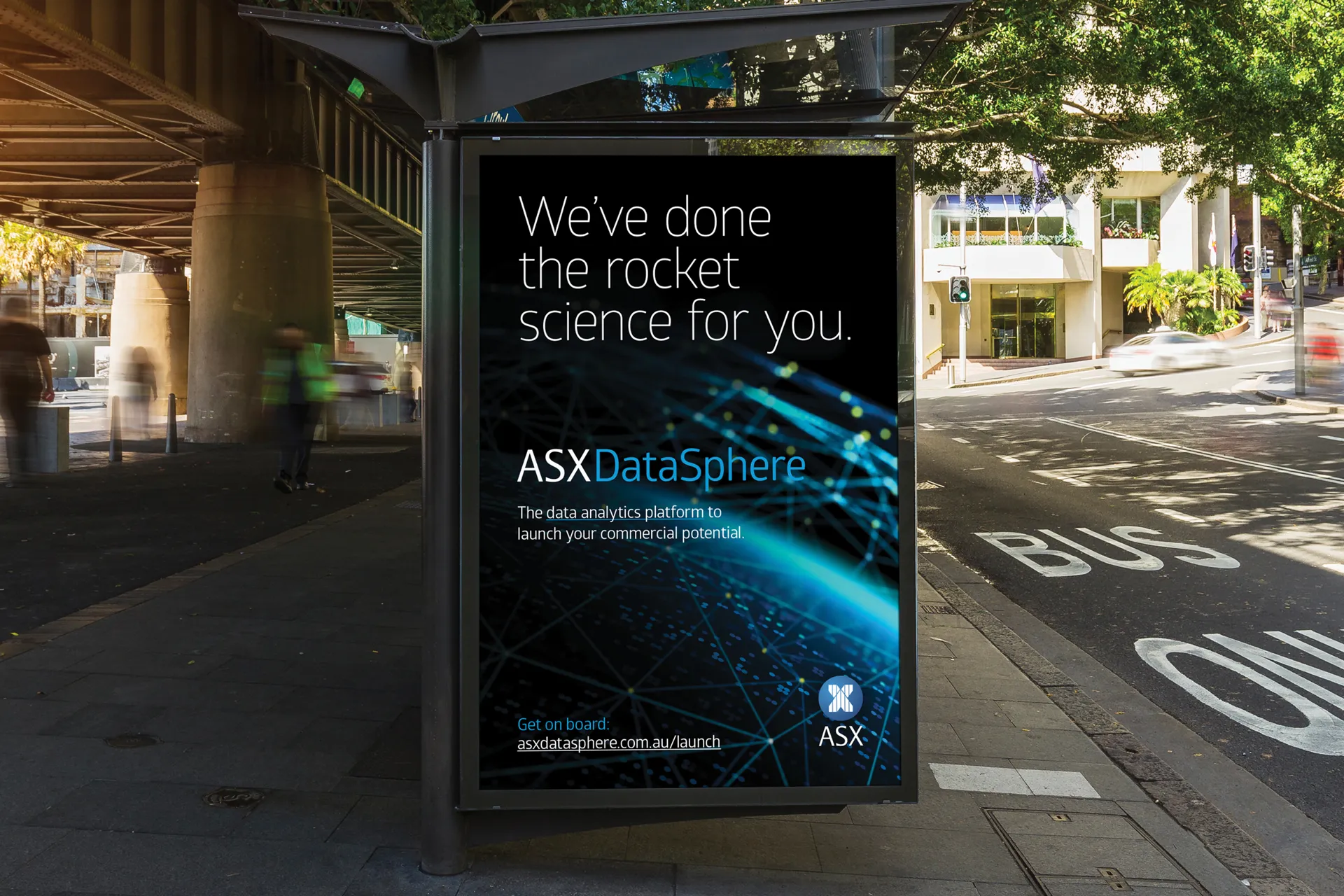 Outdoor poster for ASX DataSphere reading “We’ve done the rocket science for you” on a city street.