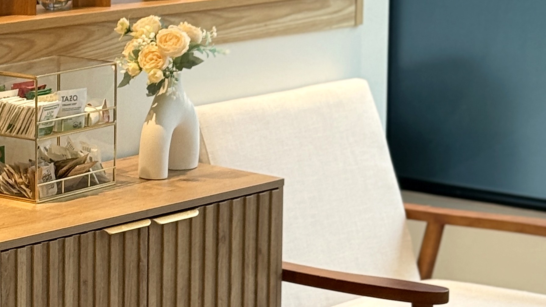 Fresh flowers beside a chair in the Materna Health office
