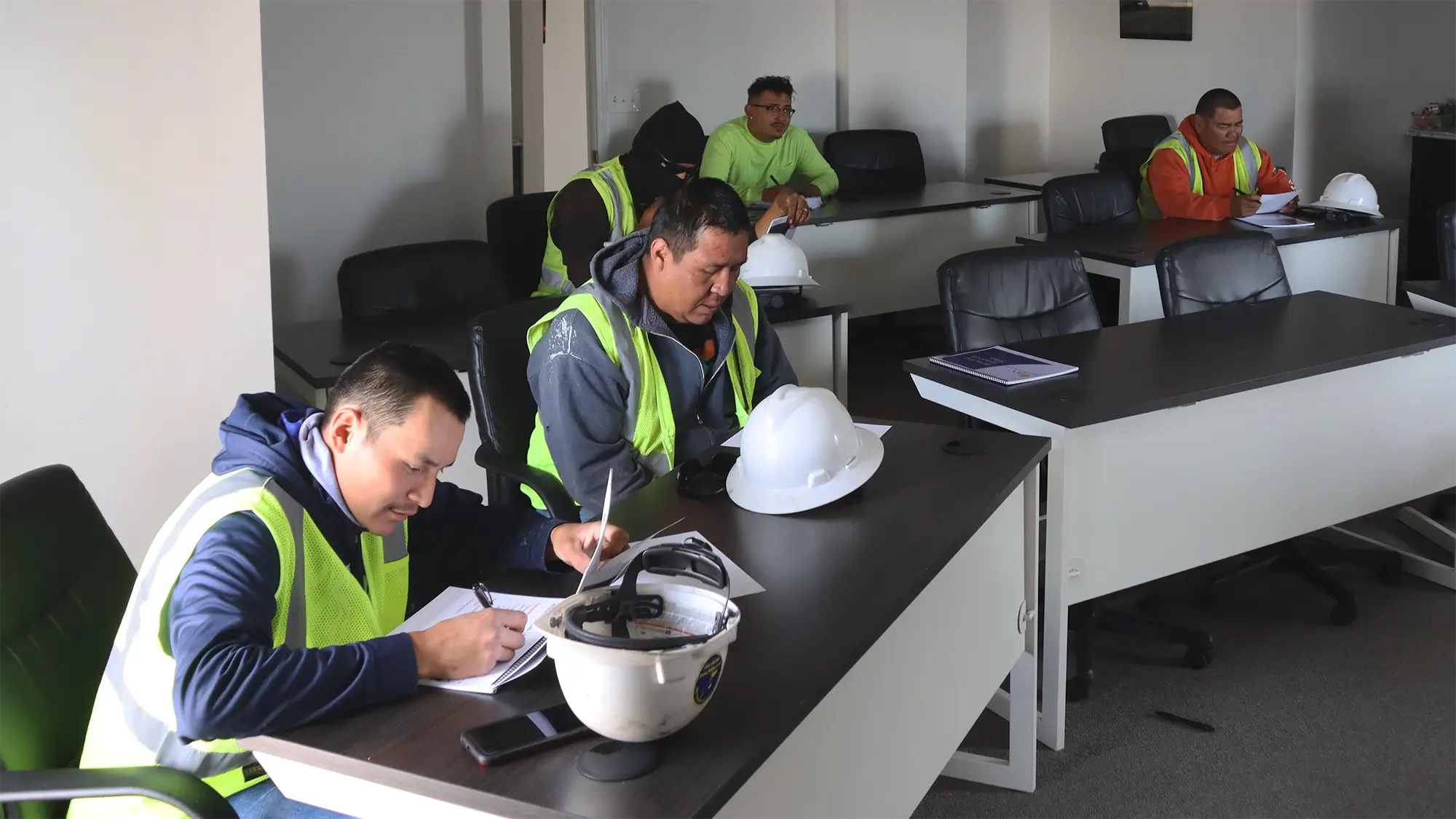 Crane operator students in classroom training during telescopic crane certification course.