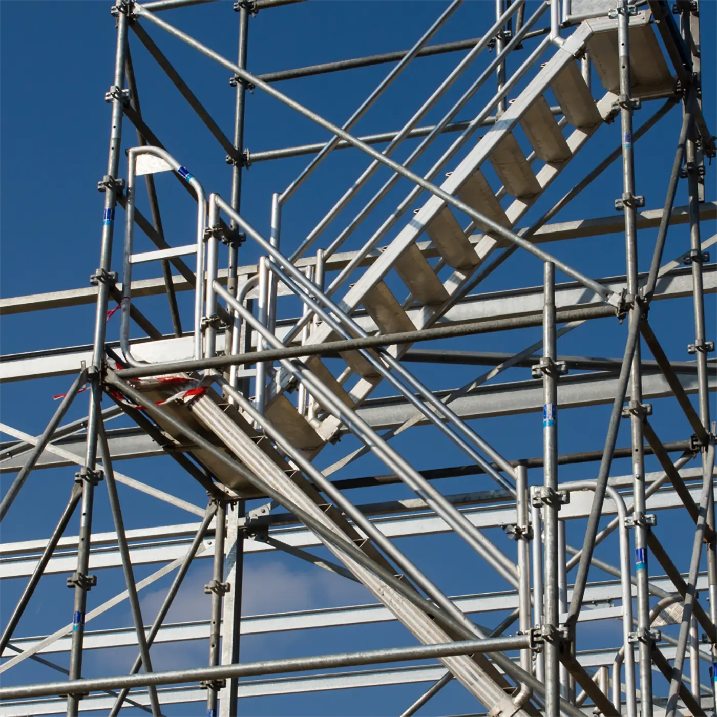 Close-up of scaffolding stair system used in competent person training for safe access.